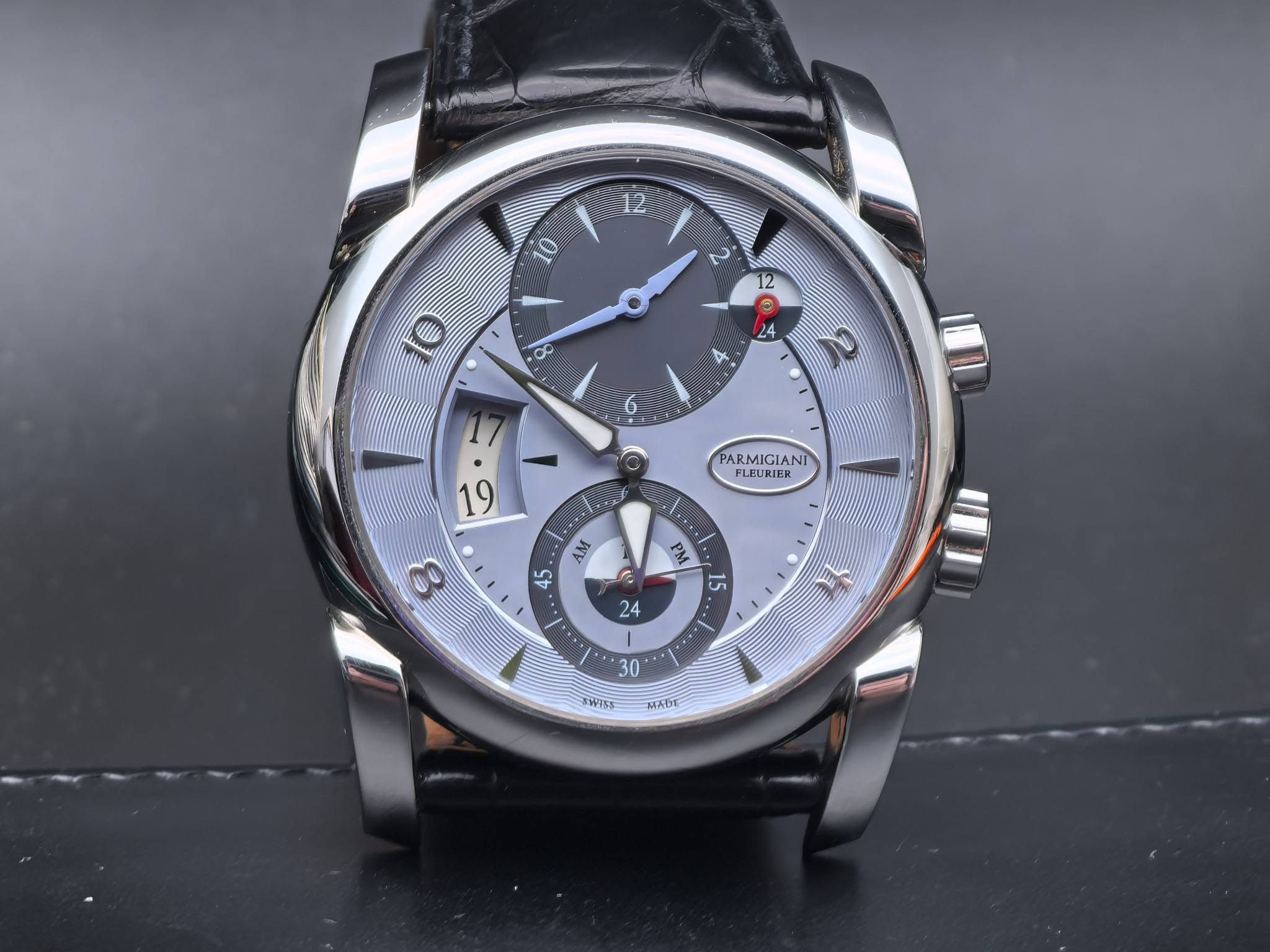 May be an image of wrist watch and text