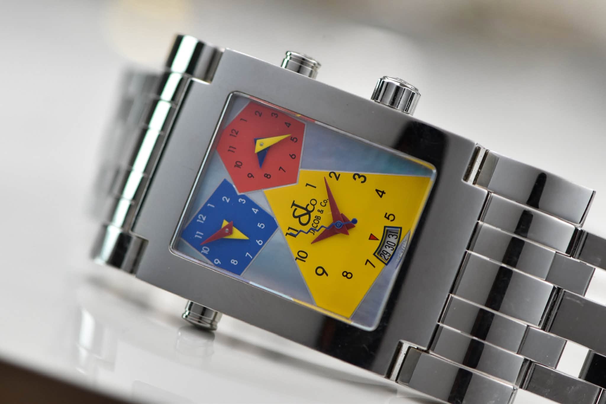 May be an image of wrist watch and text that says '3 2 DCOB& &Co Co. '
