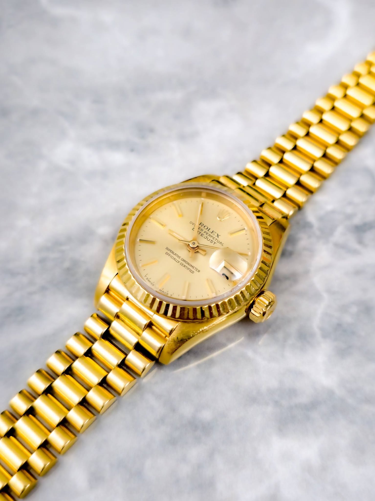 May be an image of wrist watch and text