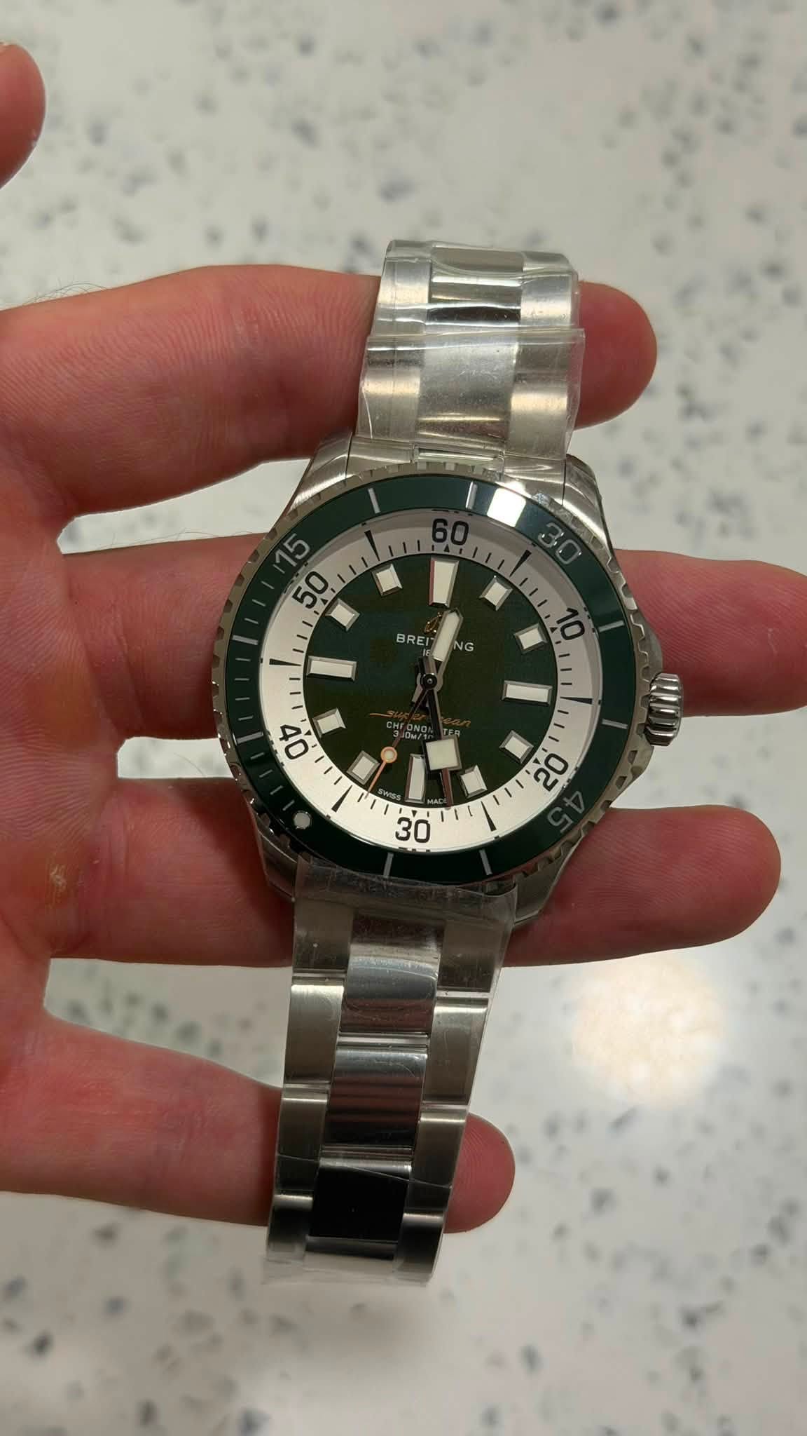 May be an image of wrist watch and text