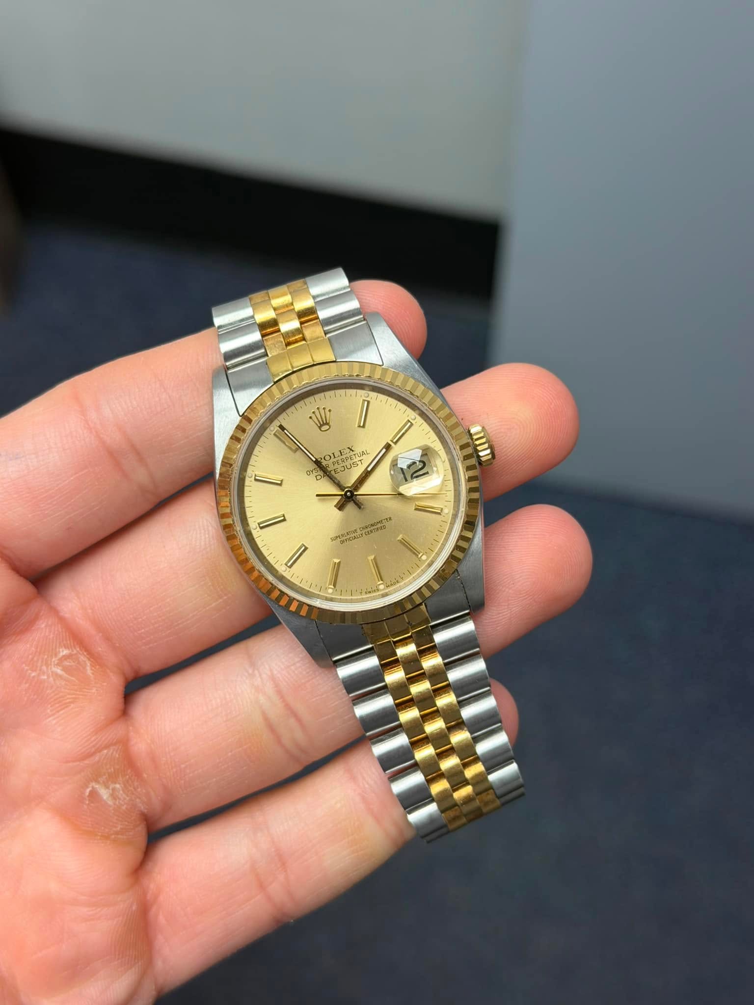 May be an image of wrist watch and text