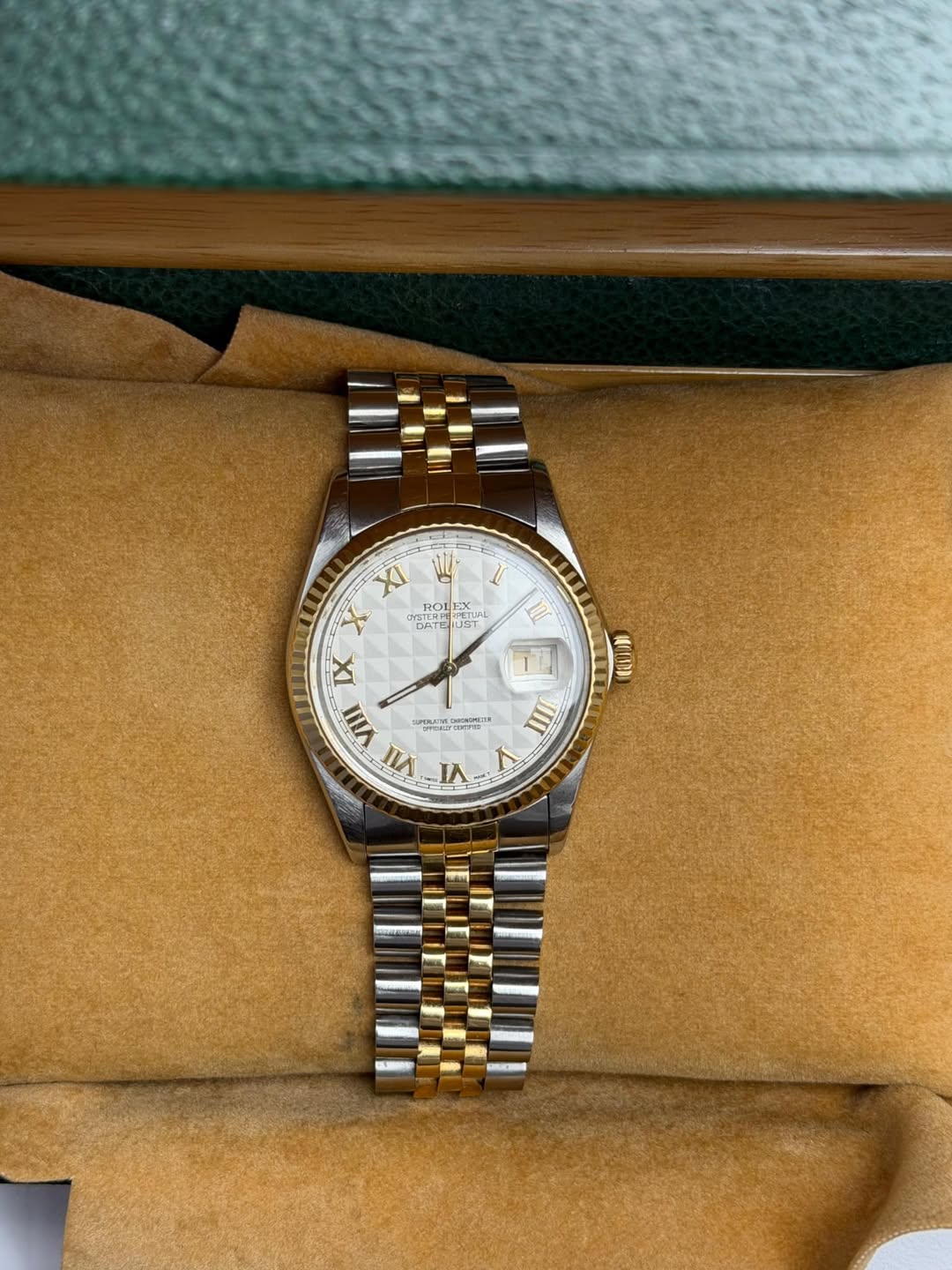 May be an image of wrist watch and text