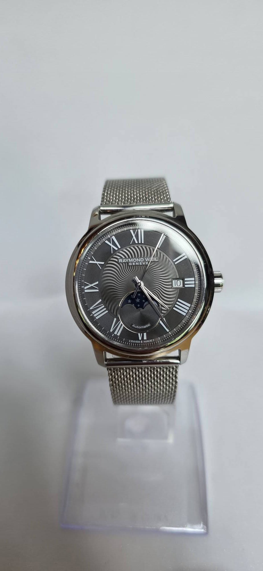 May be an image of wrist watch and text