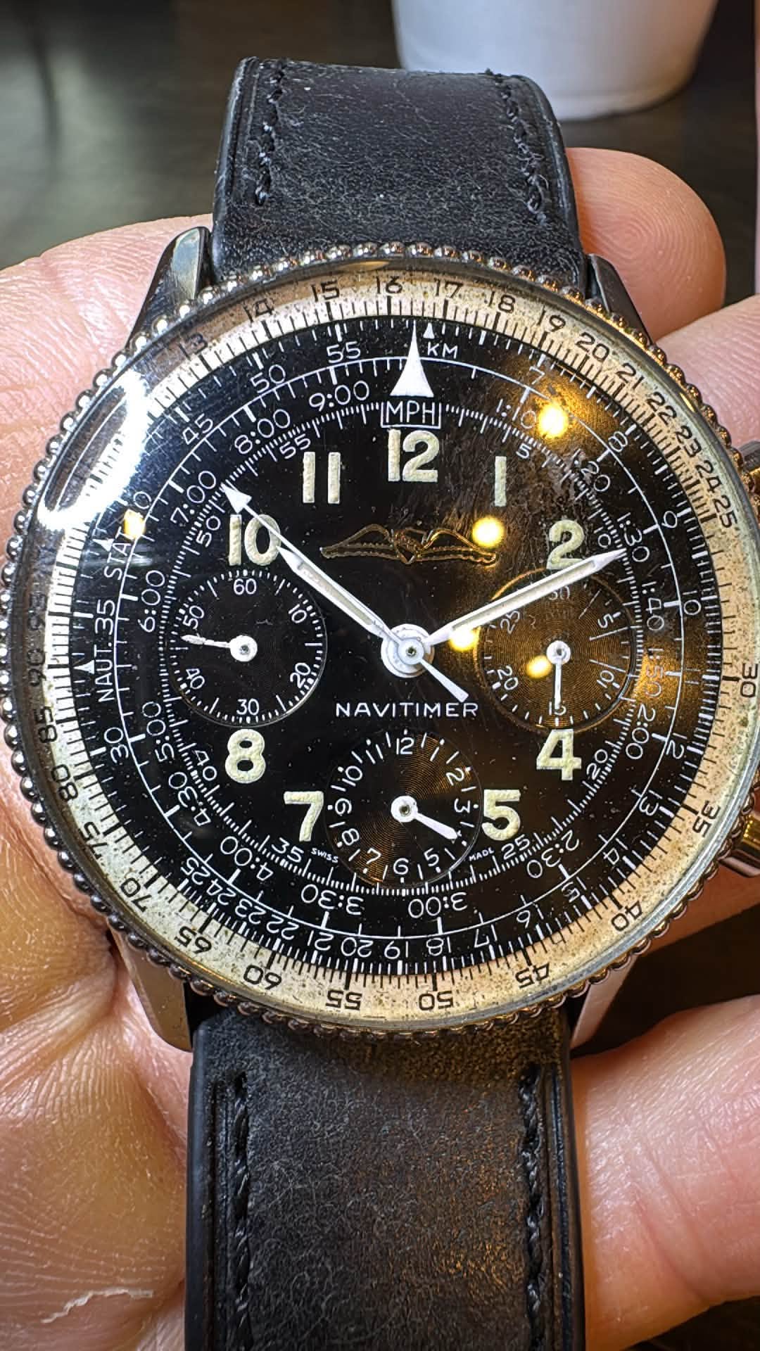 May be an image of wrist watch and text