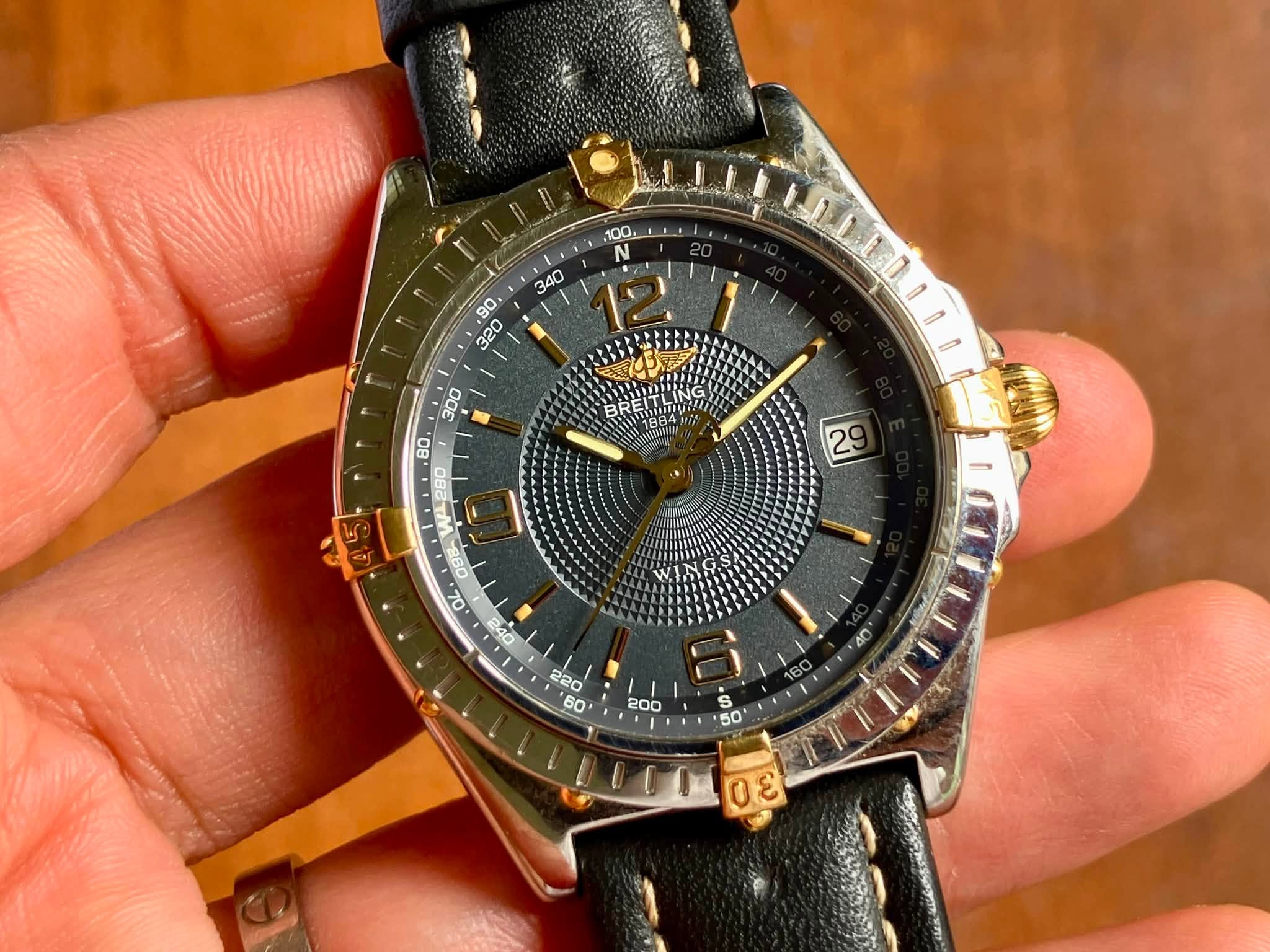 May be an image of wrist watch and text