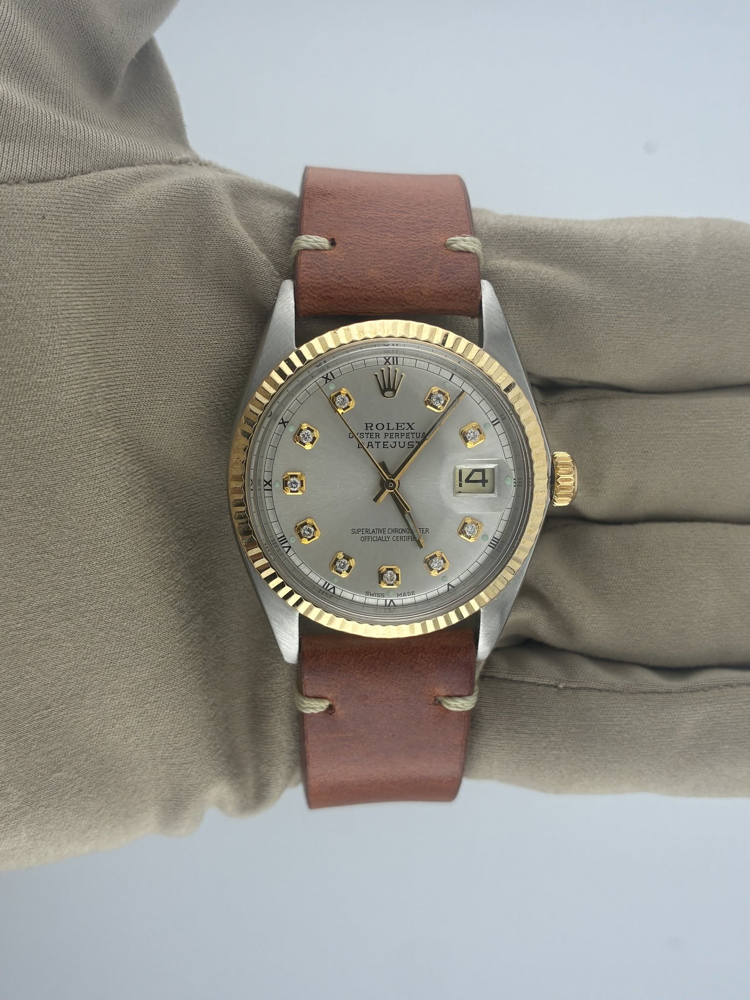 May be an image of leather and wrist watch