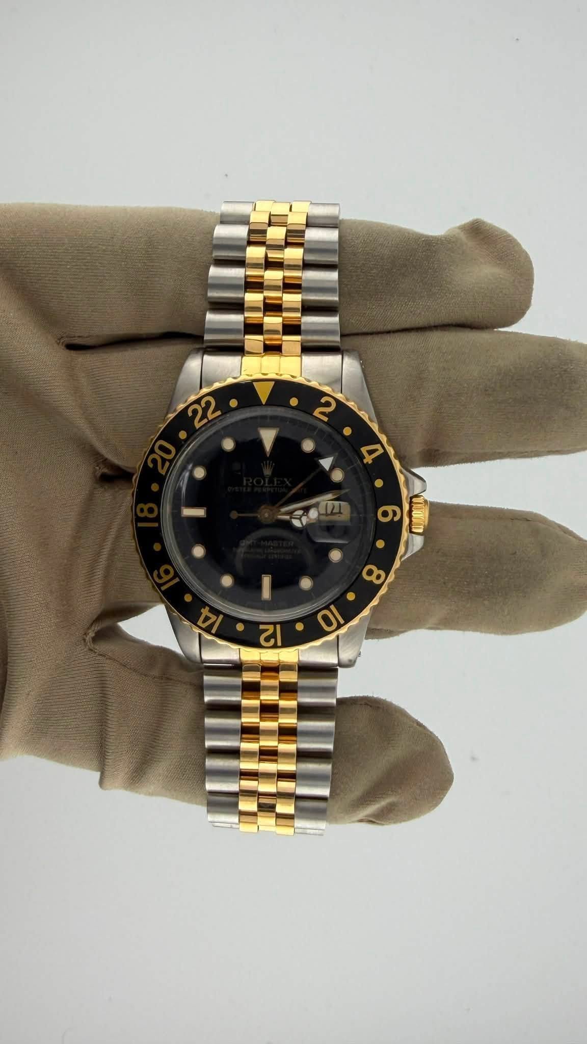 May be an image of wrist watch and text