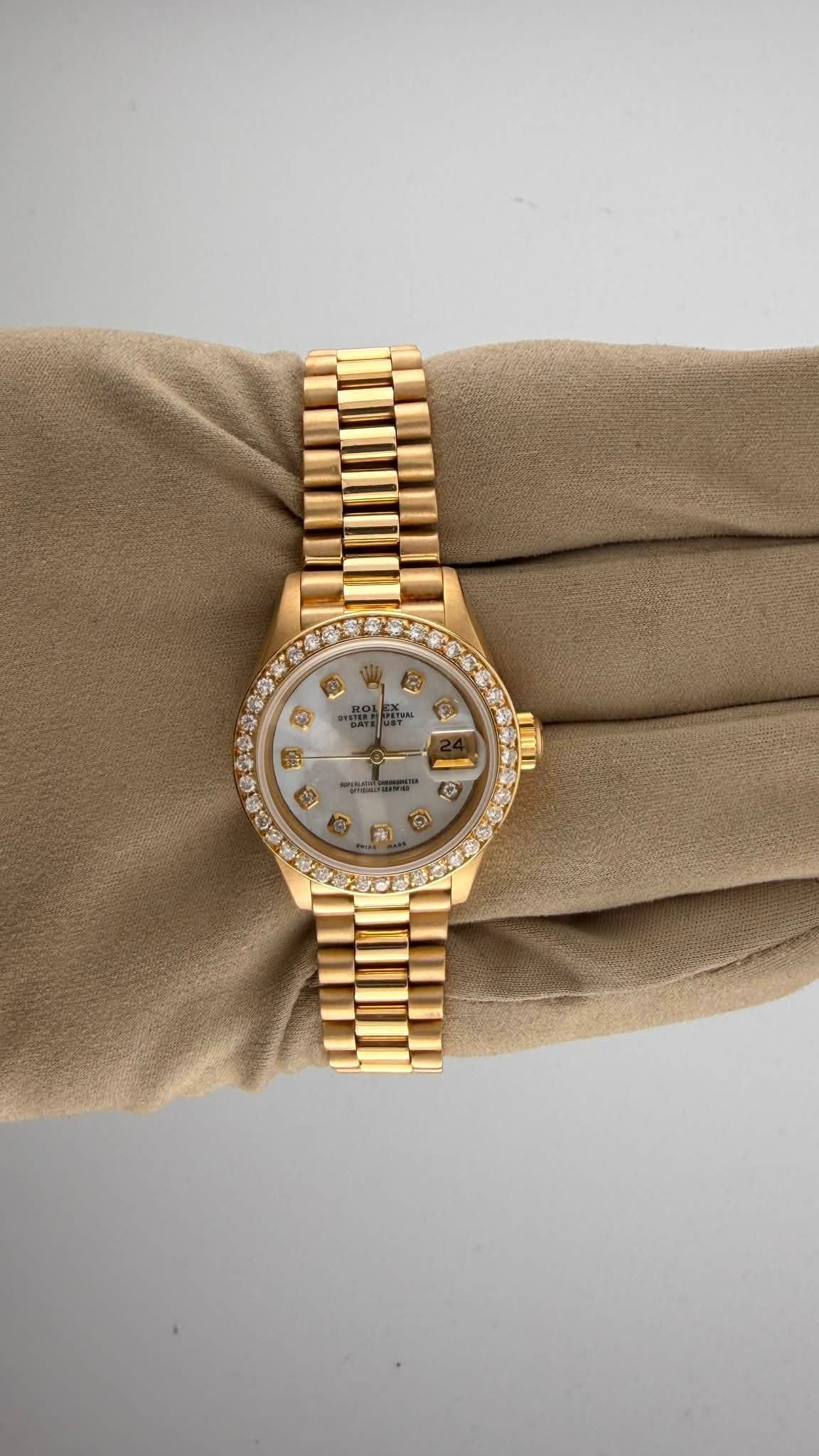 May be an image of wrist watch and text