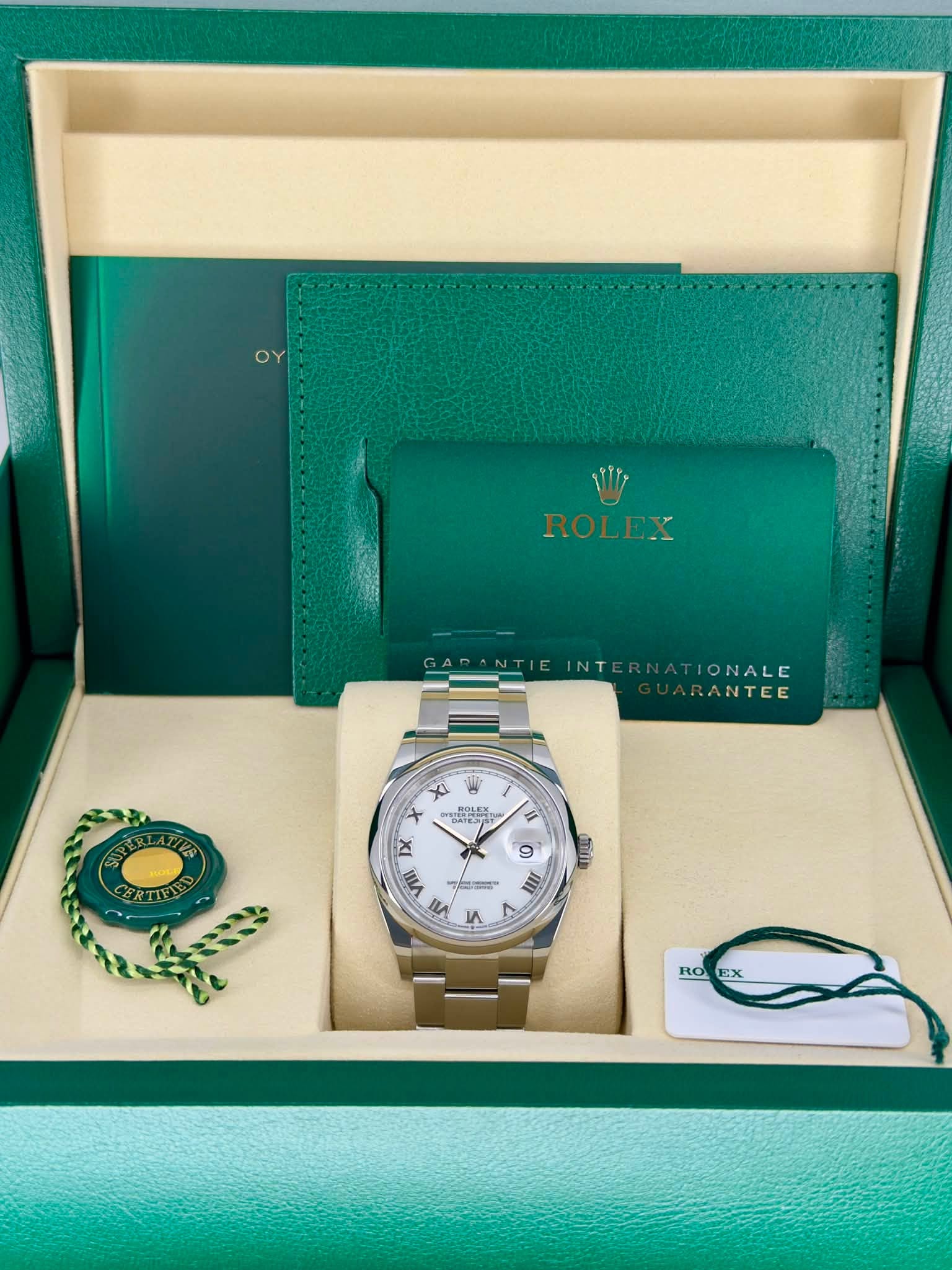 May be an image of wrist watch and text that says 'ROLEX GARANTIEINTERNATIONALE RN TIONALE GADANTIE GAP INT RANTEE E স POLE UATEJY x CERTIELO 9 انلله viii n! 5 دء RO EX'