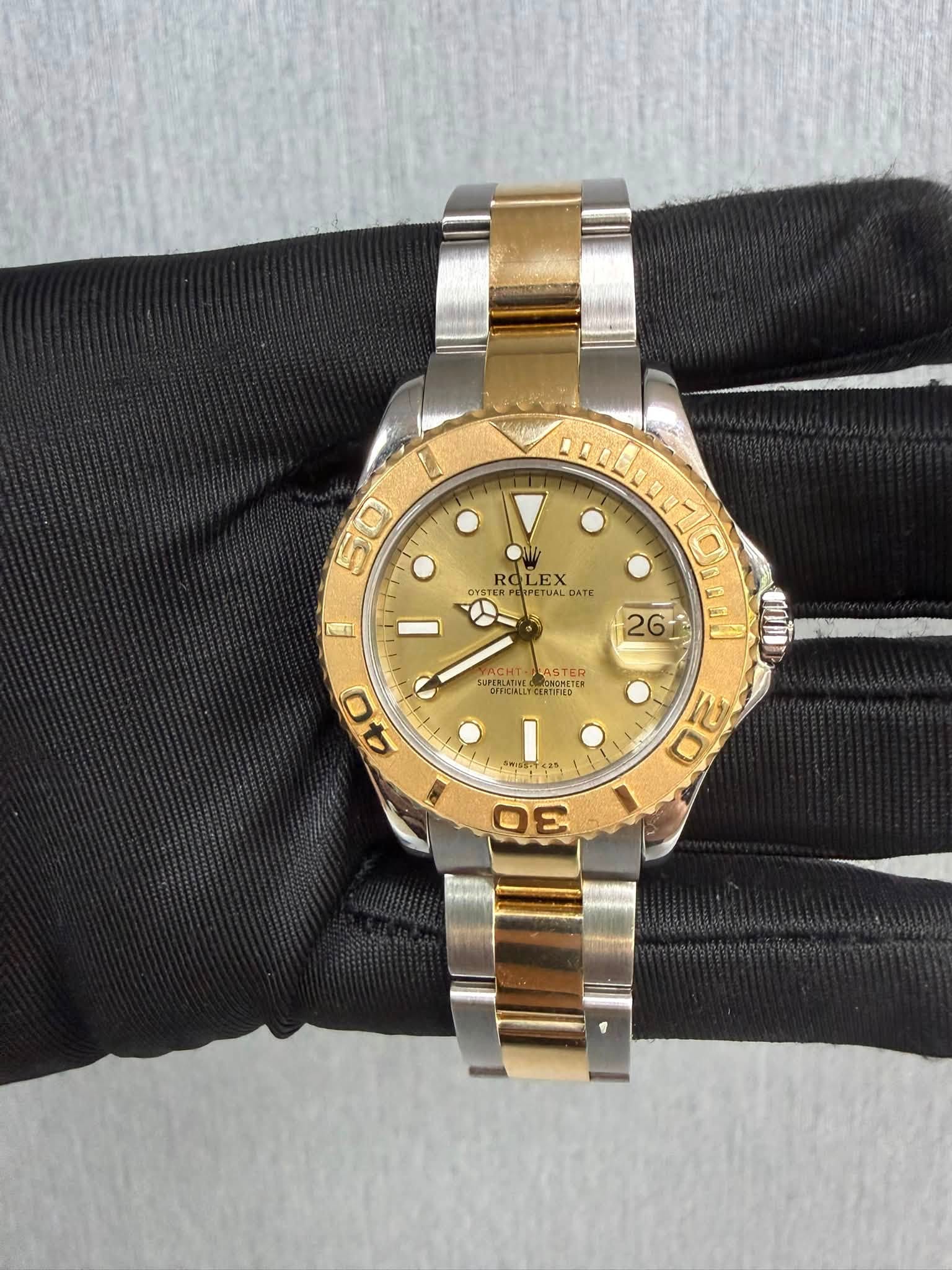 May be an image of wrist watch and text