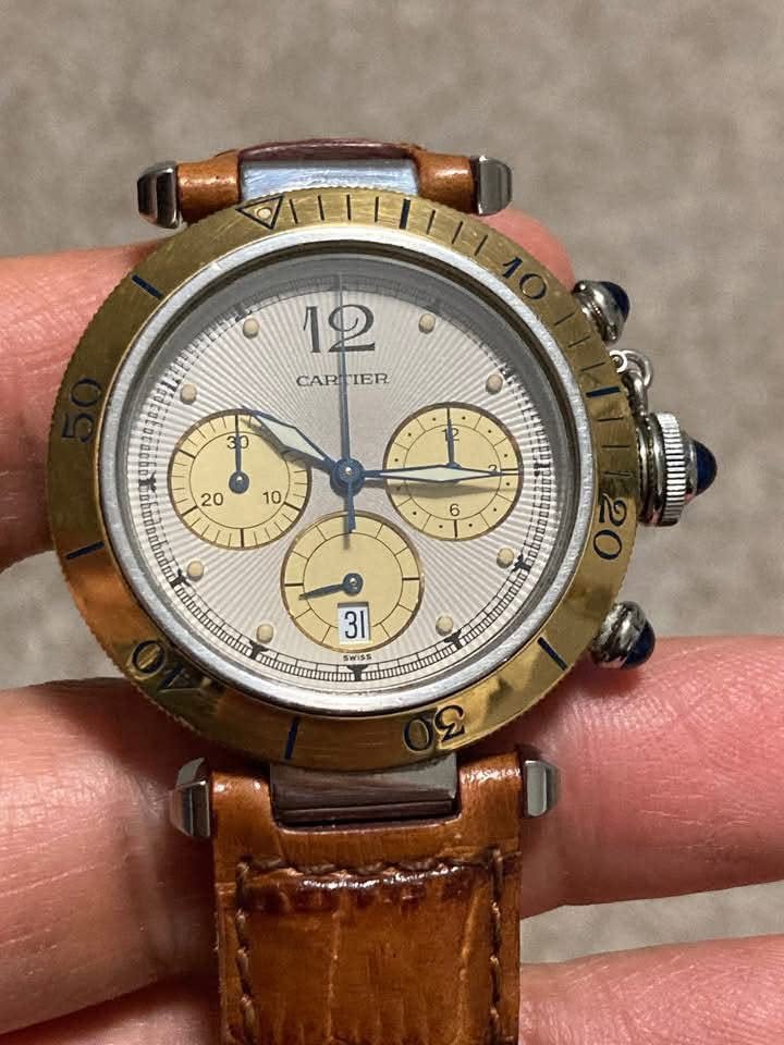 May be an image of wrist watch and text