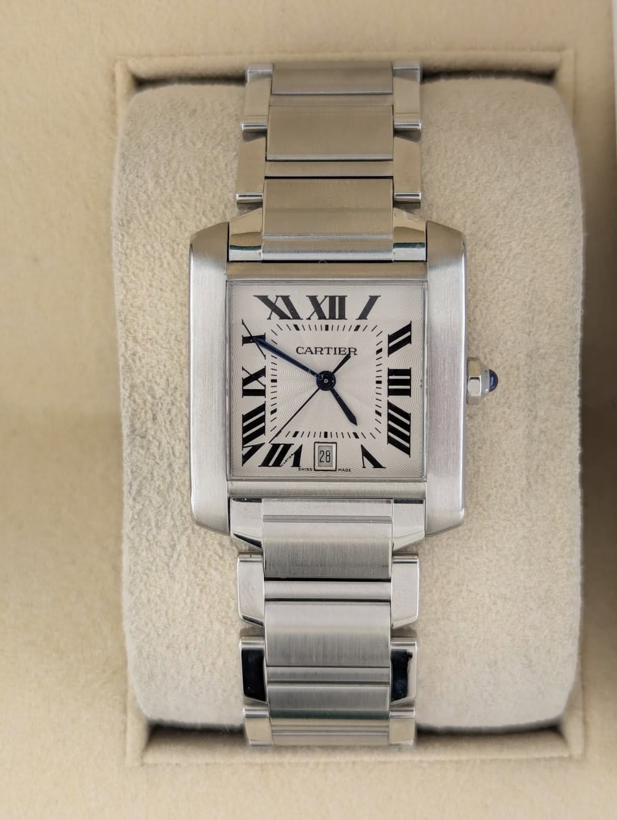 May be an image of wrist watch and text