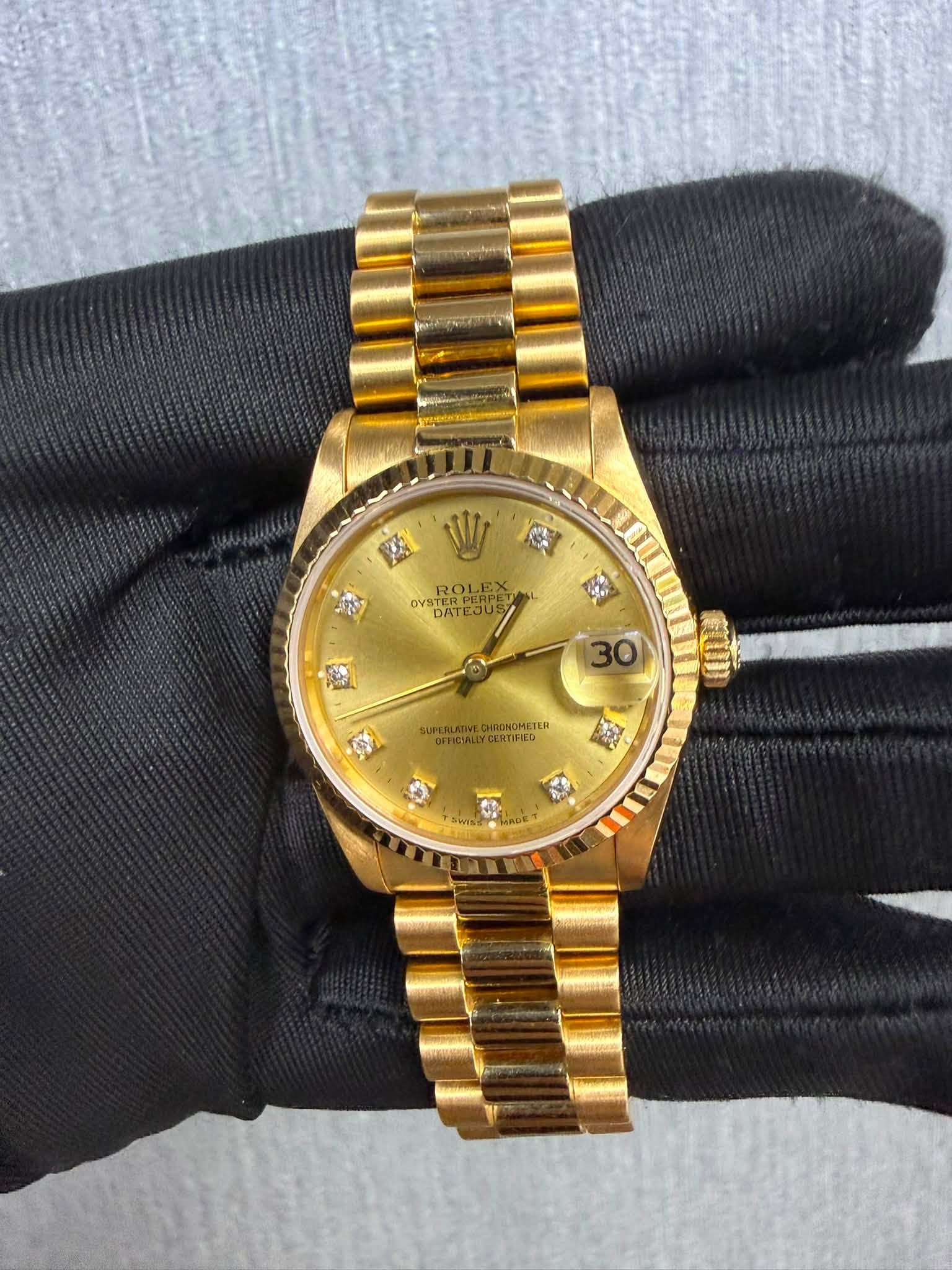 May be an image of wrist watch and text