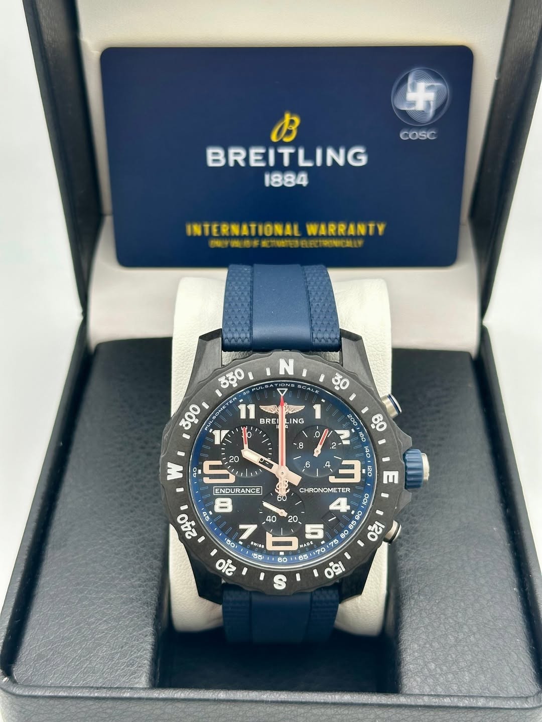 May be an image of wrist watch and text that says 'COSC B BREITLING 1884 INTERNATIONAL WARRANTY TOTC N 7 CALK ಕೆಕ್ಷಂ 300 BRE LING S w 8 140, DE 10 E 60 CHRONOMETER CHRON ETER ENDU…