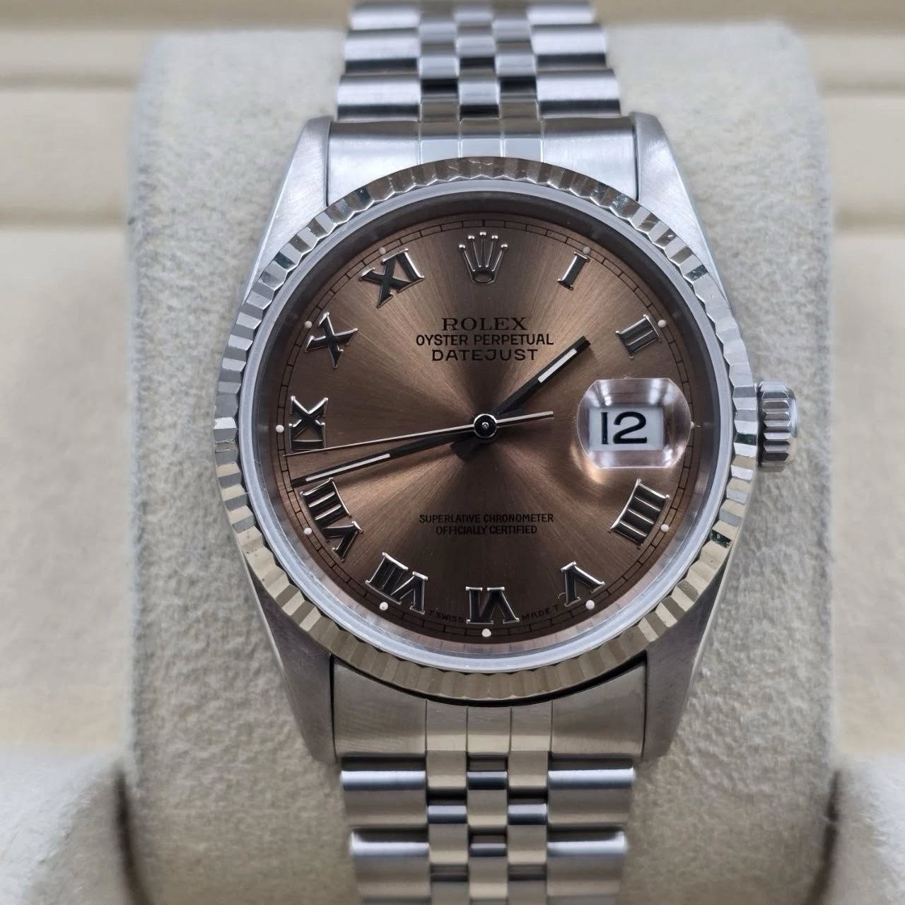 May be an image of wrist watch and text