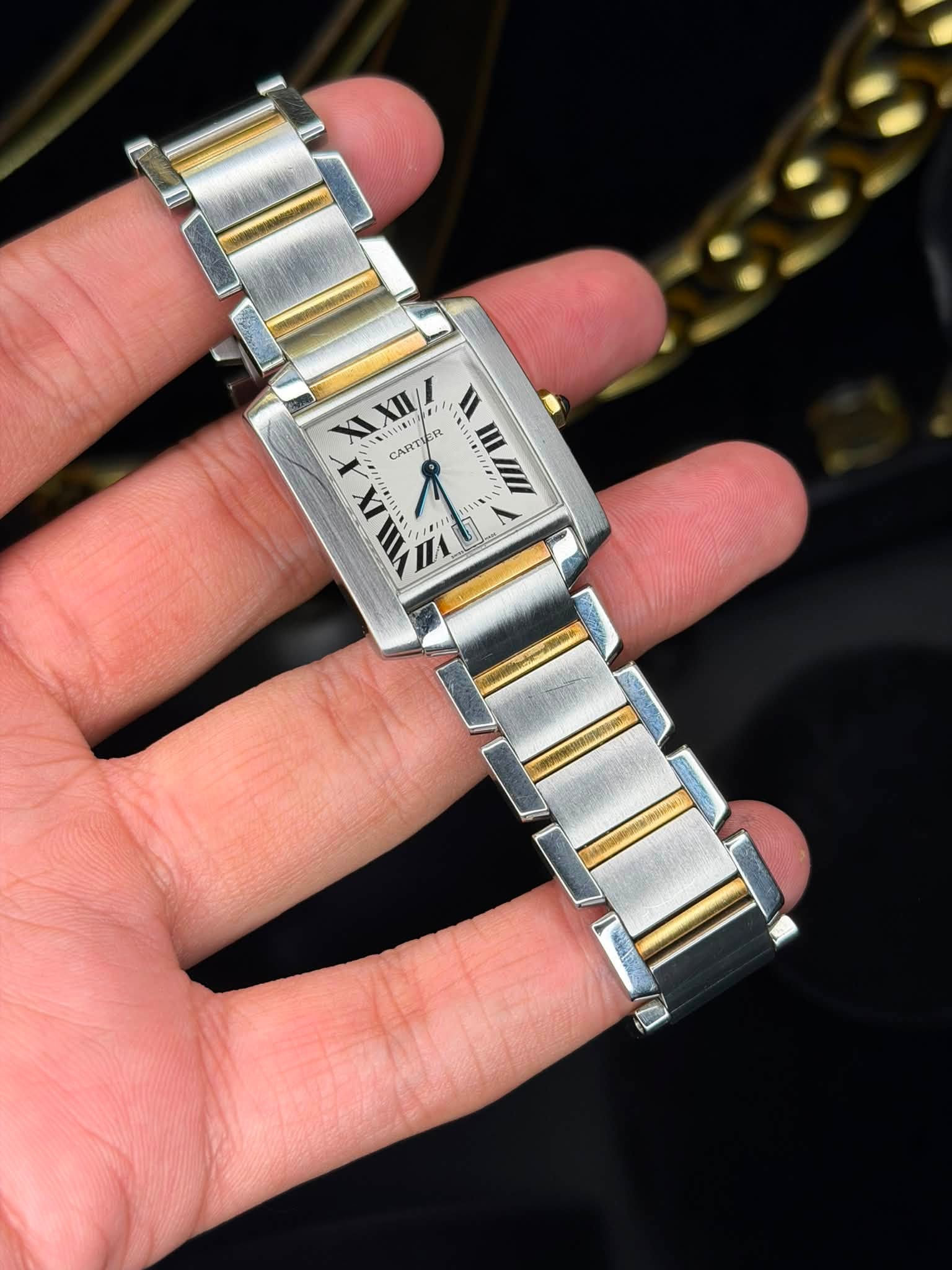 May be an image of wrist watch and text