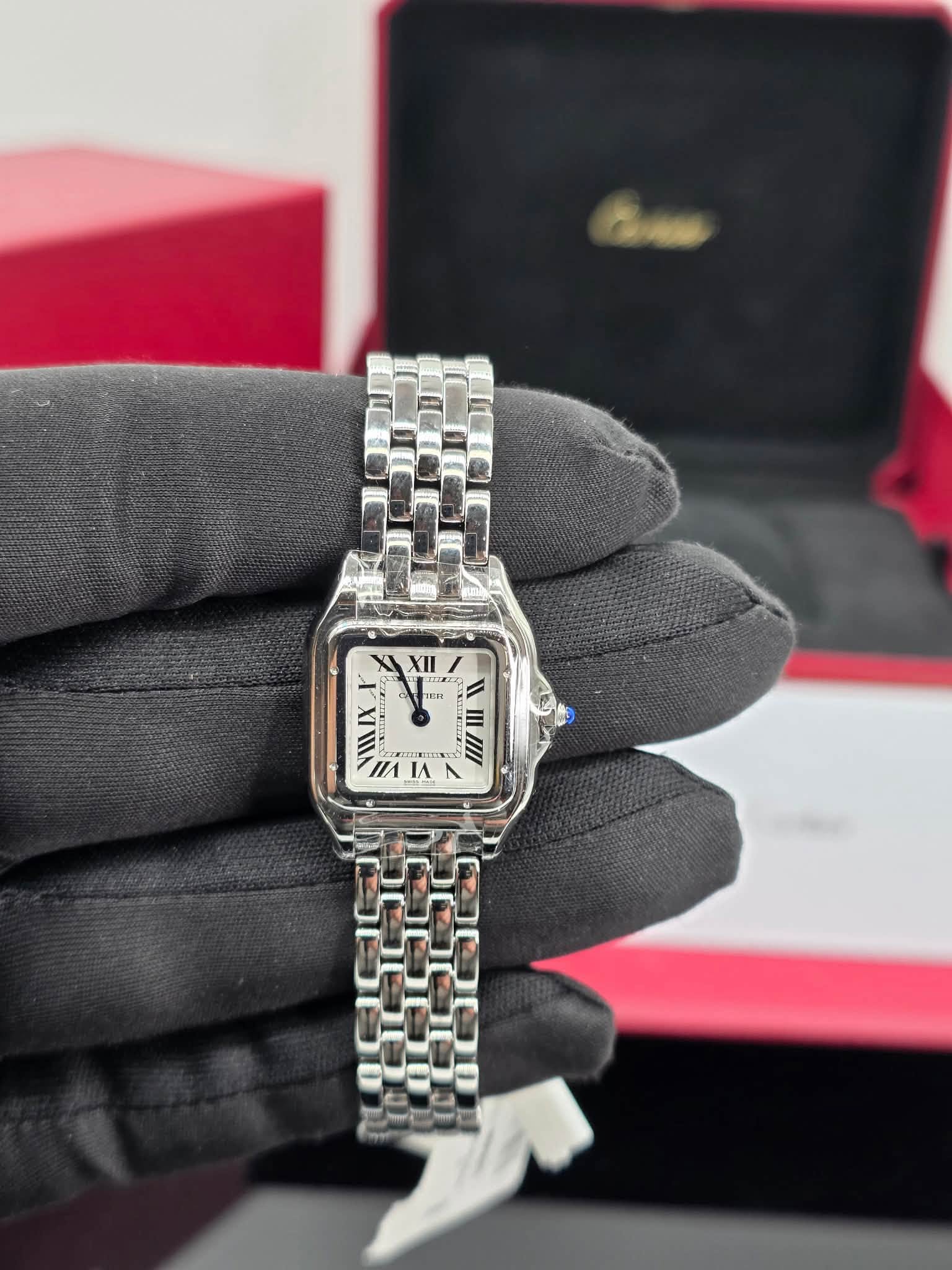 May be an image of wrist watch and text
