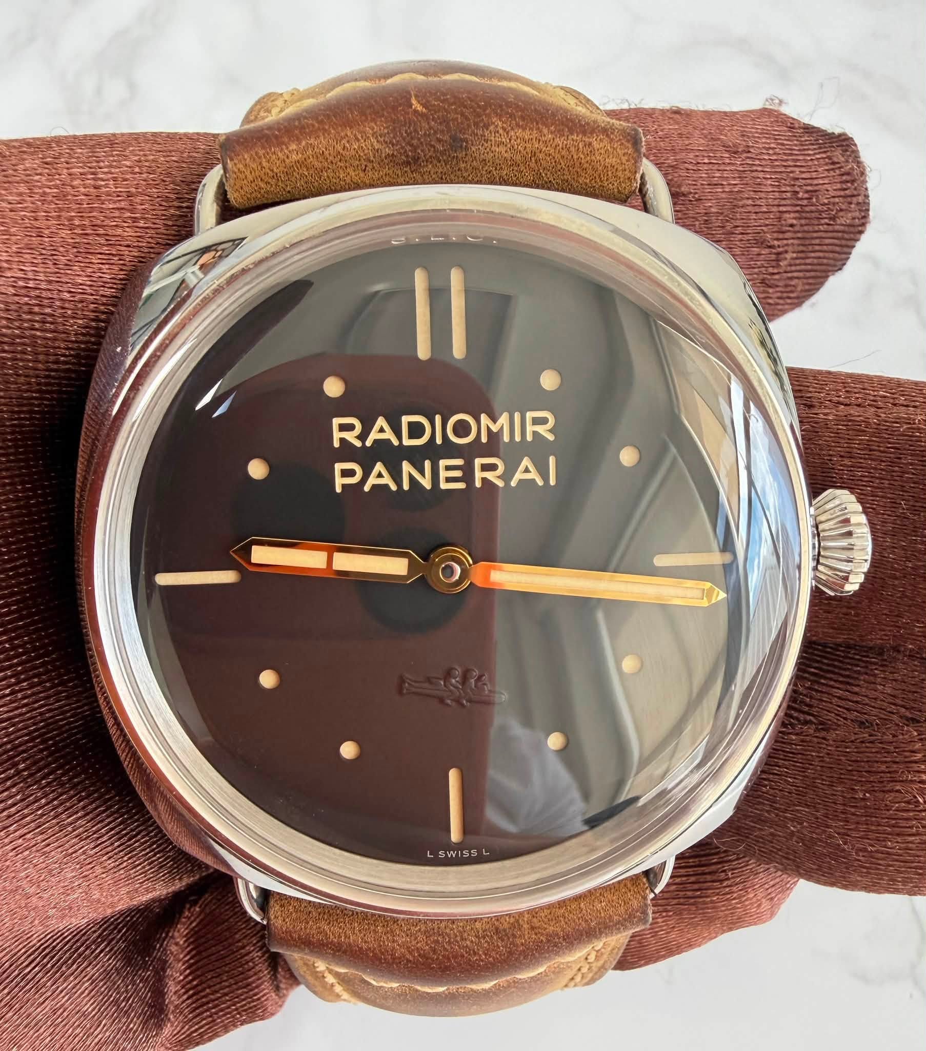 May be an image of wrist watch and text that says 'II RADIOMIR PANERAI SWISS WISS'