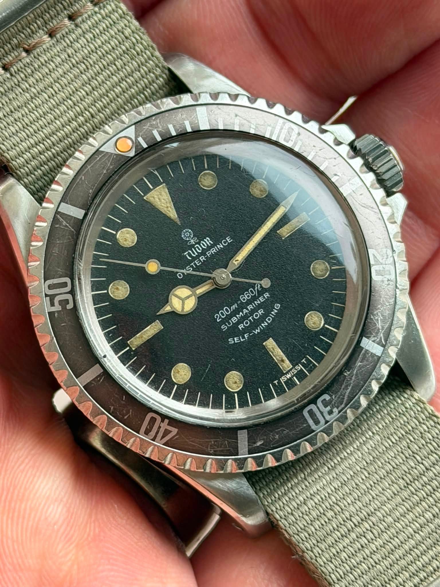 May be an image of wrist watch and text that says 'TUOOR PRINCE ce N S o OKSTER 50 MARINER ROTO 660/2 200m SURMAR SU POTOR po ROTOR WINDING IN ND VI SELF CS BO SWISS 00 ព ቴታ E'