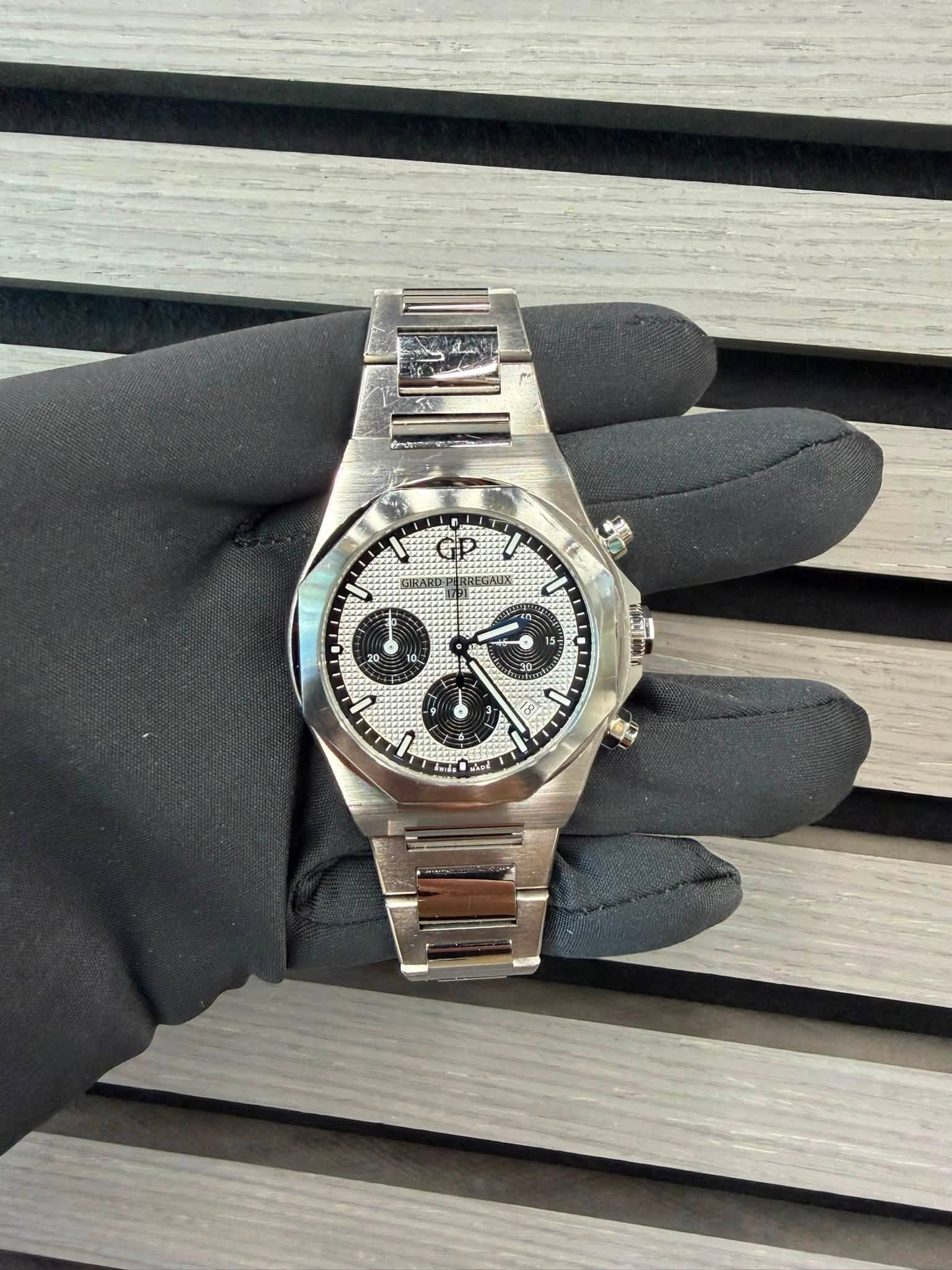 May be an image of wrist watch and text