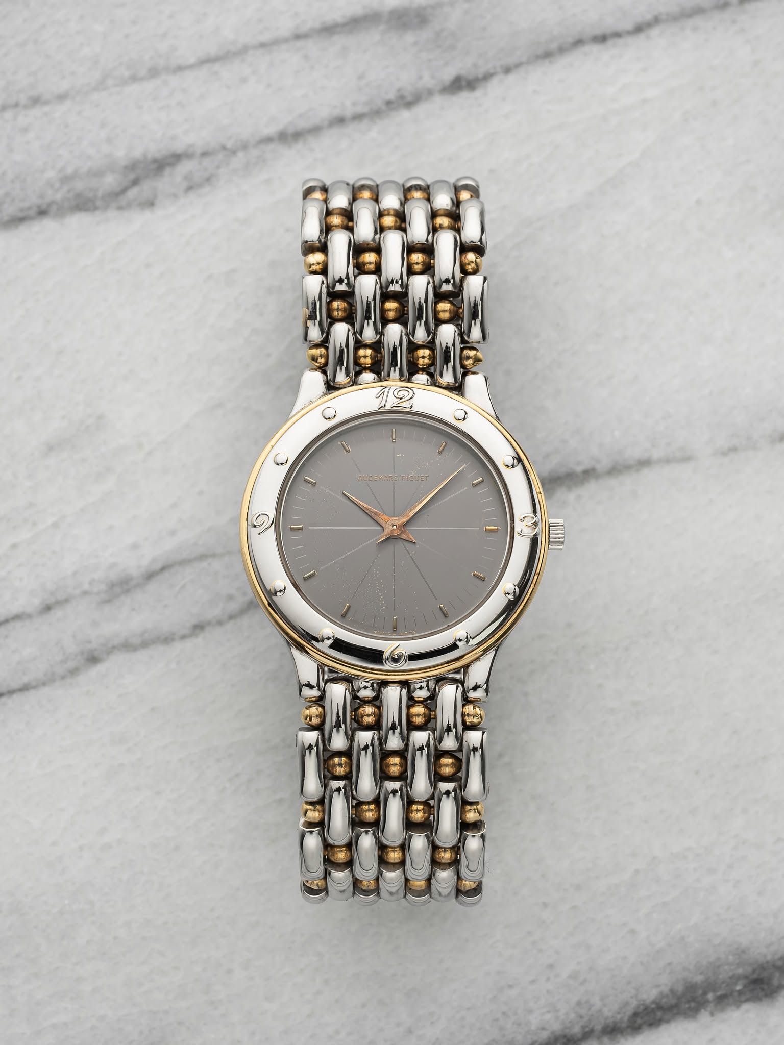 May be an image of wrist watch, jewelry and text