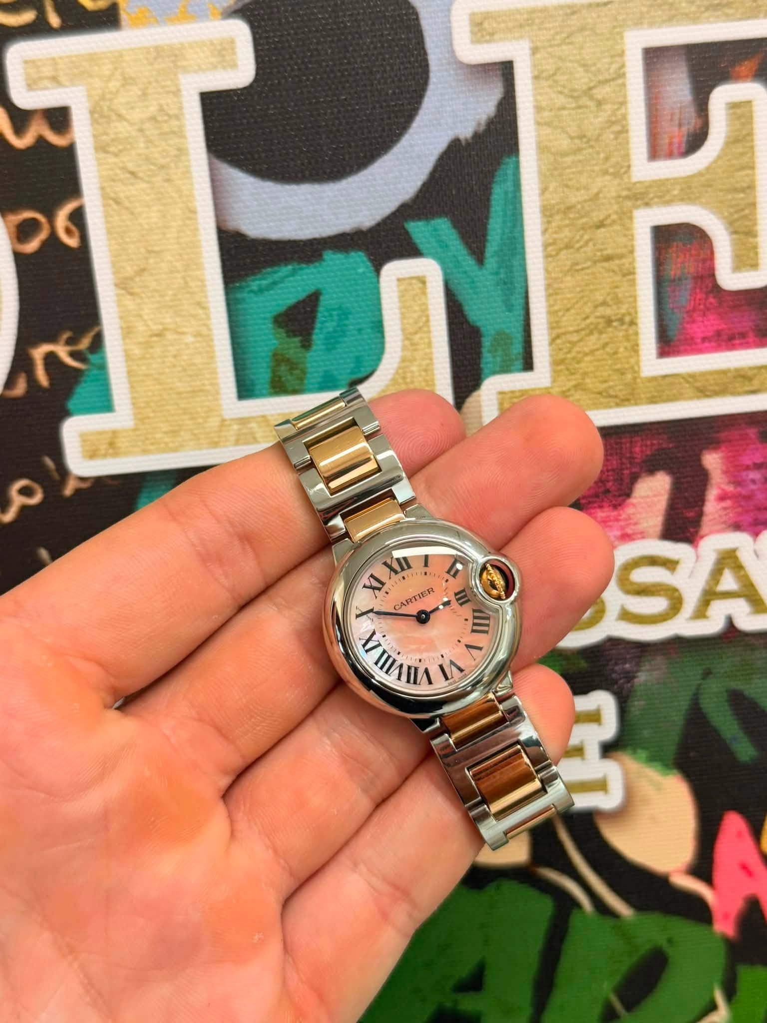 May be an image of wrist watch and text that says 'و٥ TE T م XI ειXή XII CARTIER MVIIA VIIVI ۷ E II SA 3'