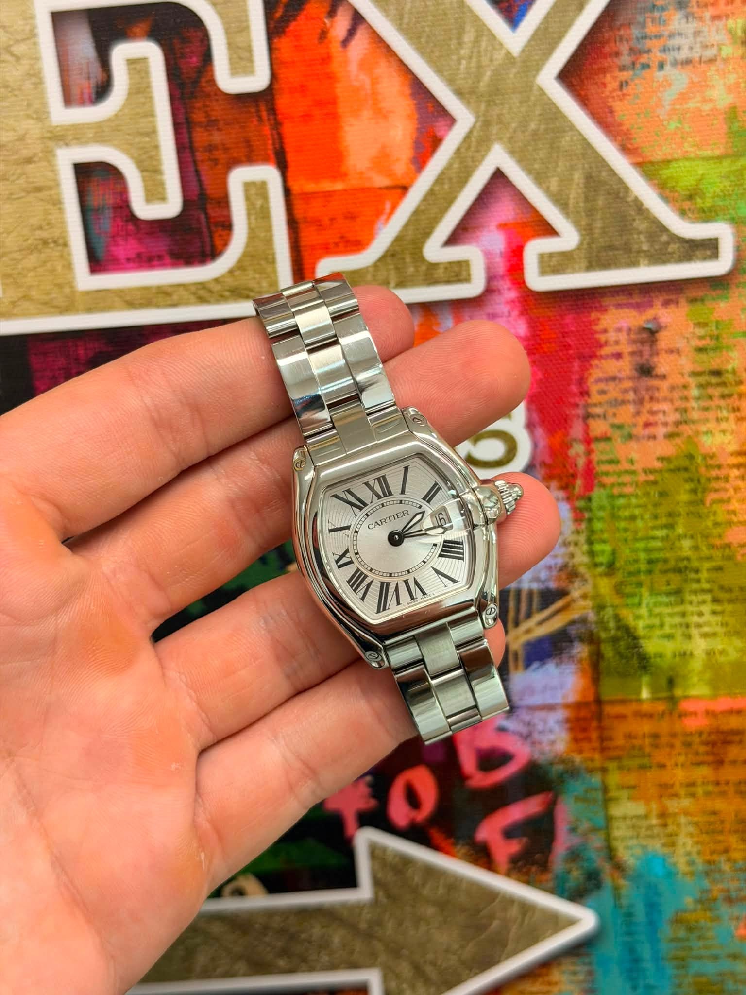 May be an image of wrist watch and text that says 'A ၃ KXII/ RILED e CARTIER WA VII VIMI IX !!! / 25 F'
