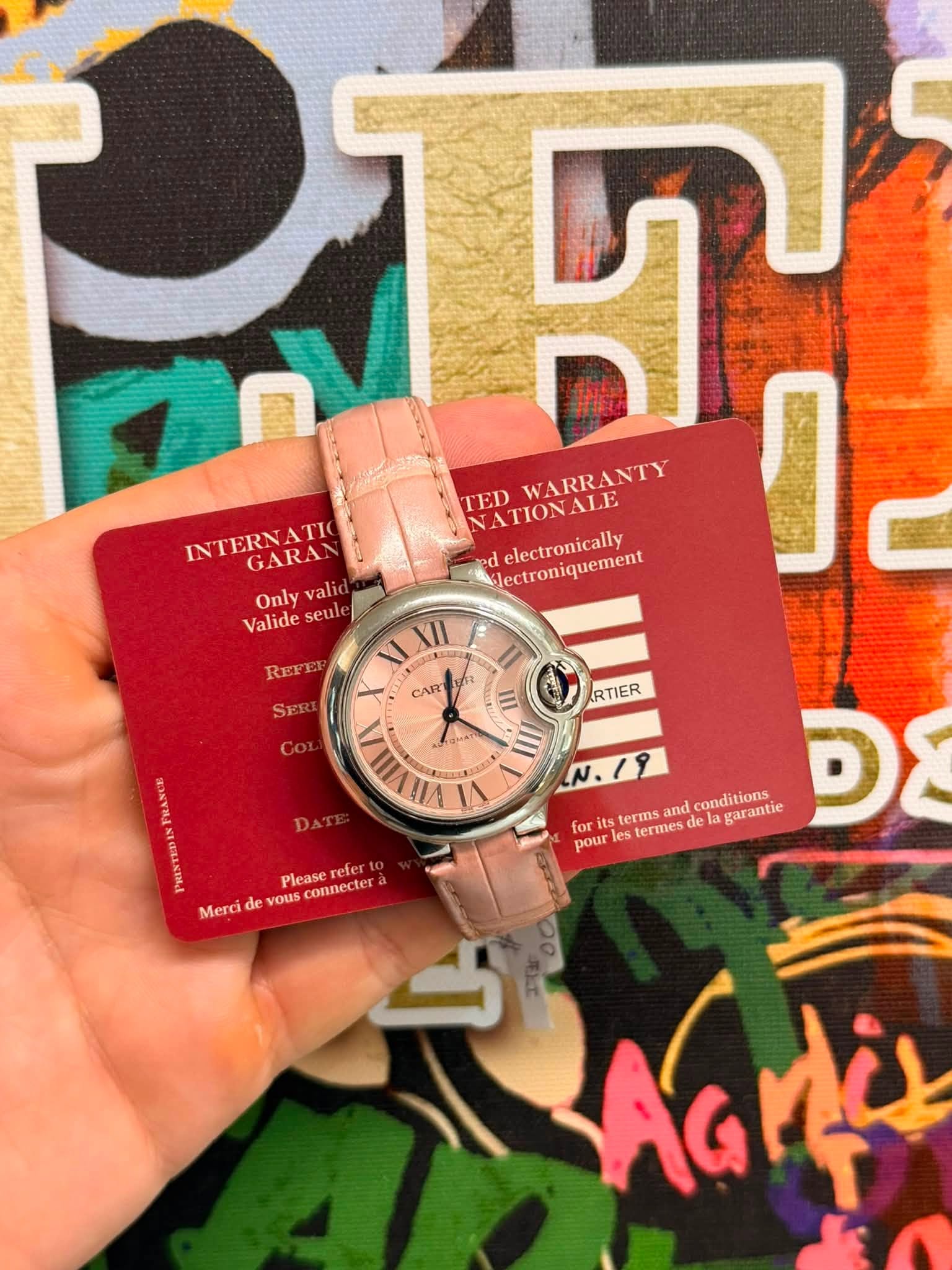 May be an image of wrist watch and text that says 'P ጥ TED NATIONALE WARRANTY INTERNATIC GARAN Only valic Slectroniquement ed electronically り Valide seule REFEE SER CART II 16 III…