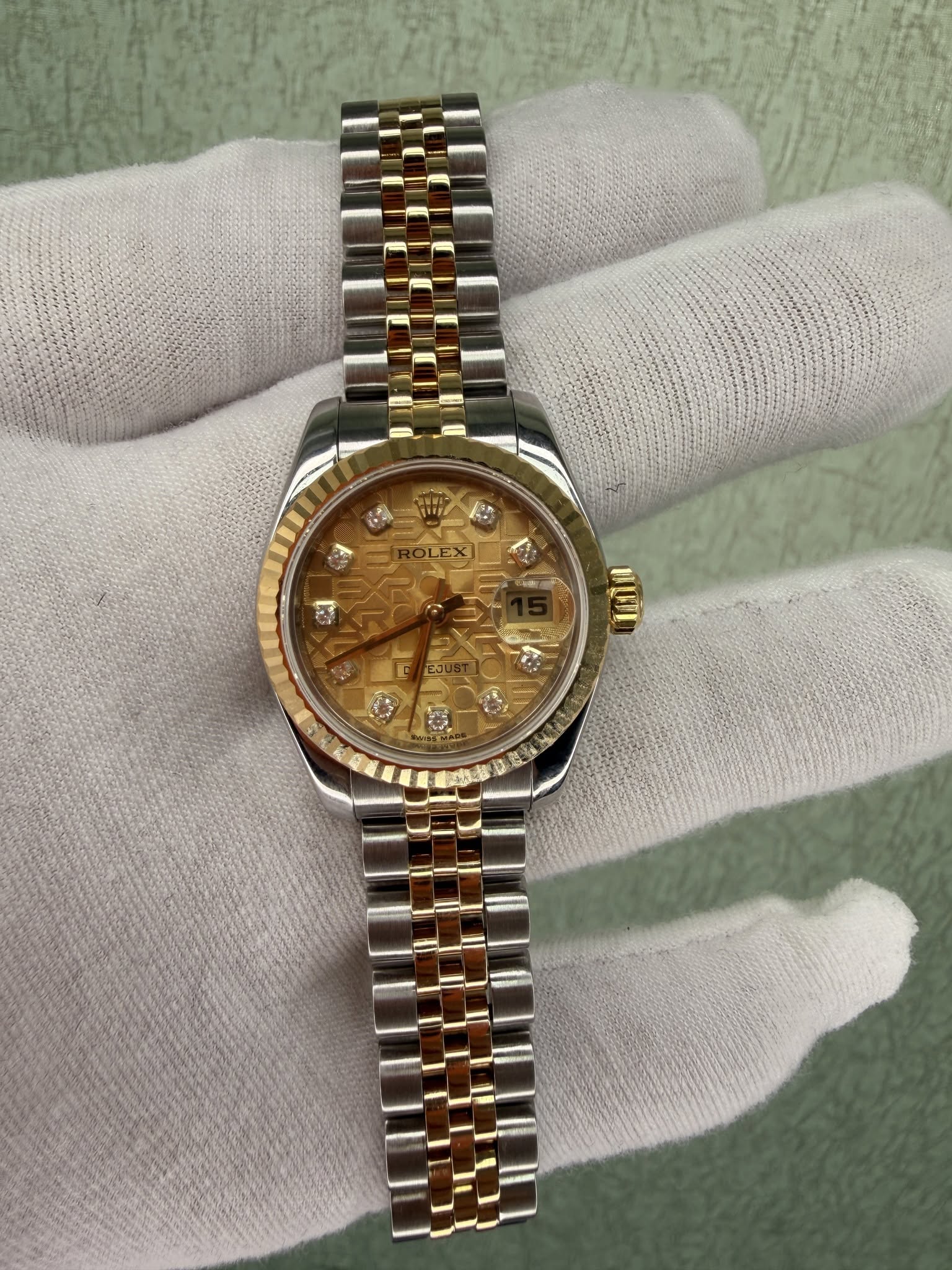 May be an image of wrist watch and text