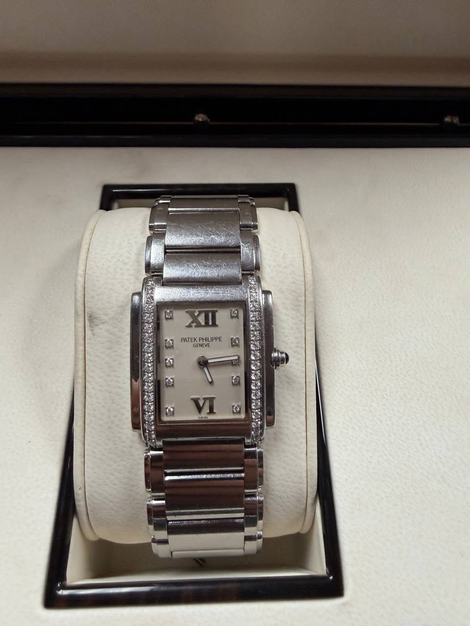May be an image of wrist watch and text
