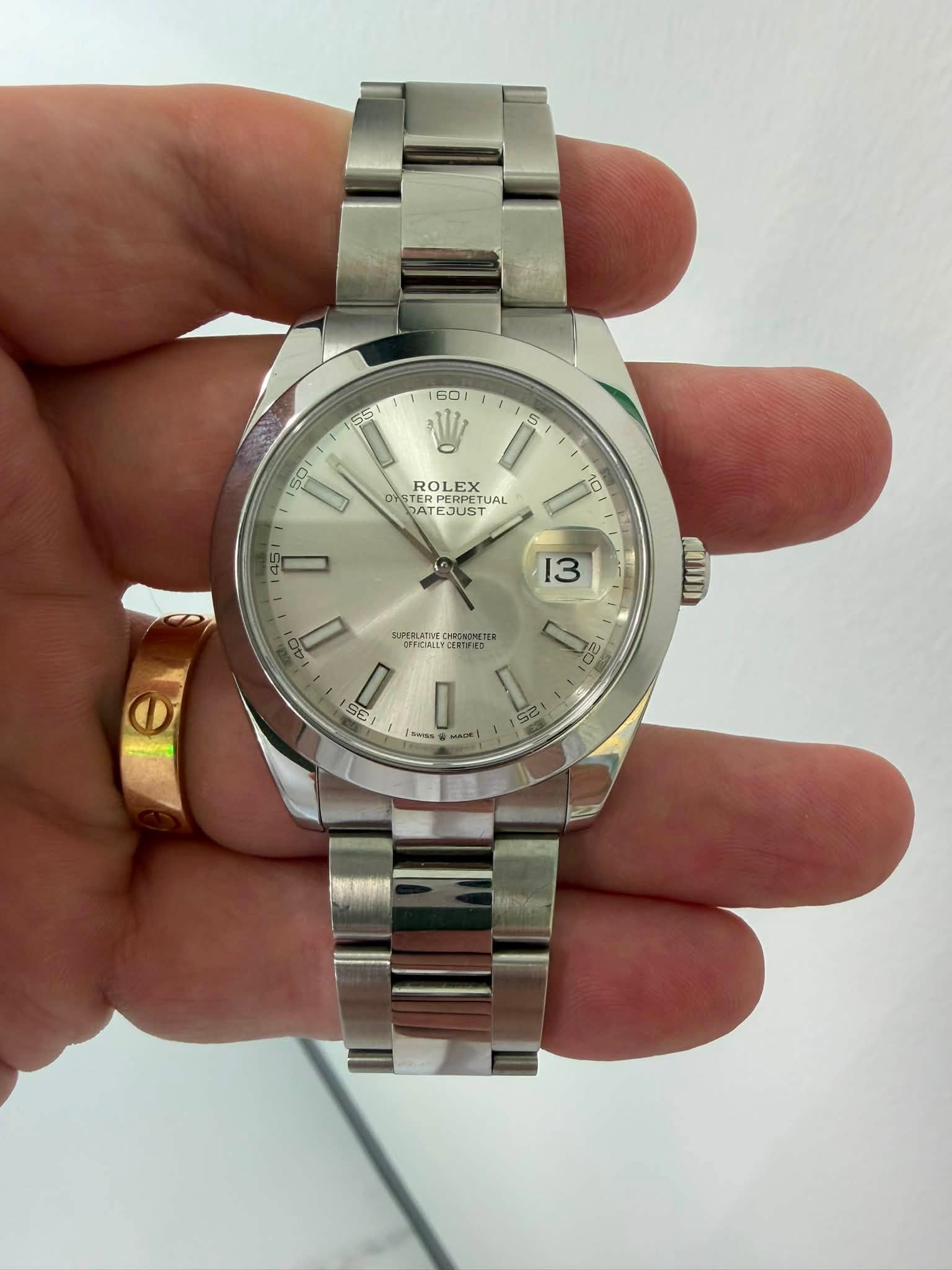 May be an image of wrist watch and text