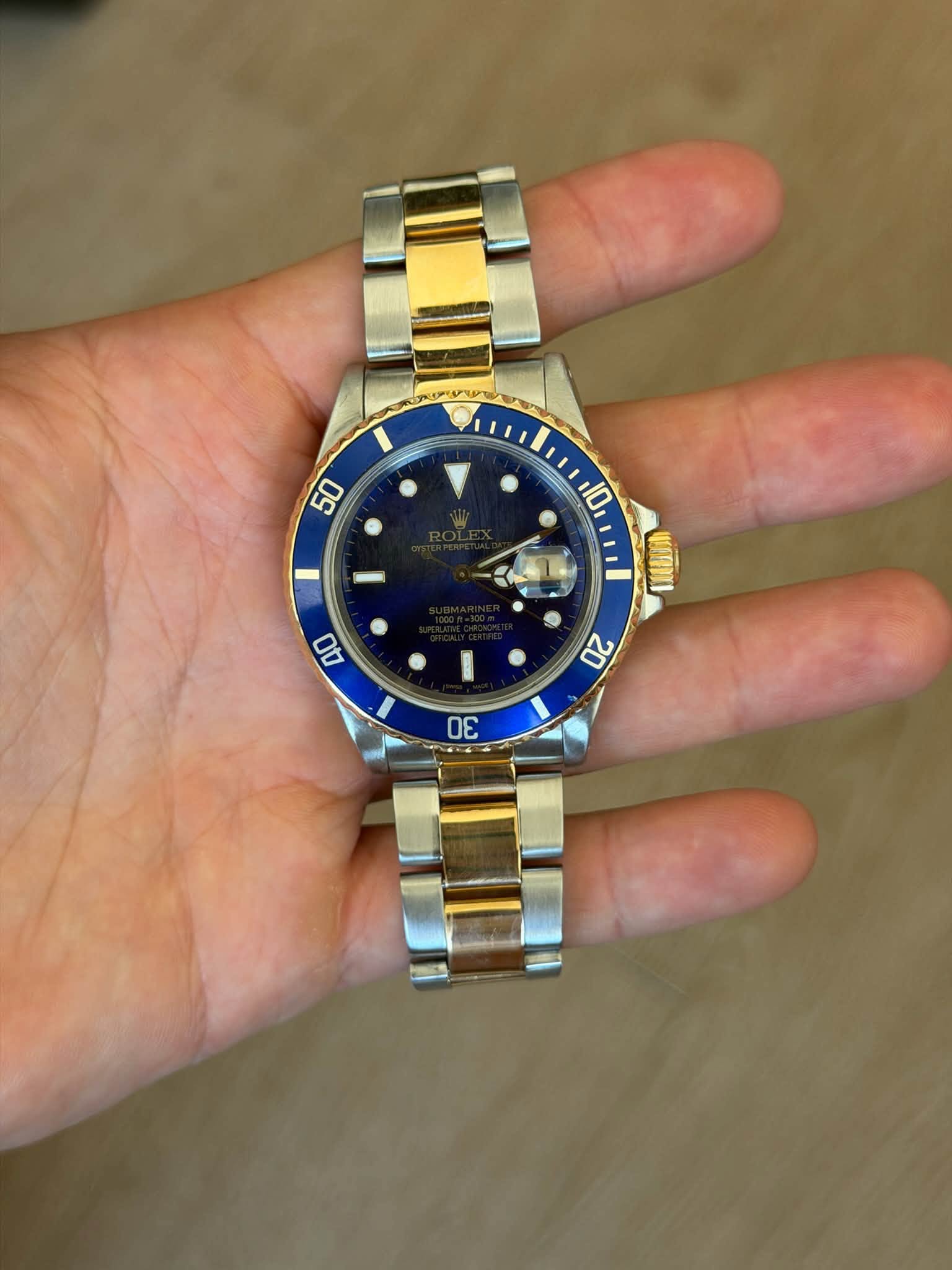 May be an image of wrist watch and text