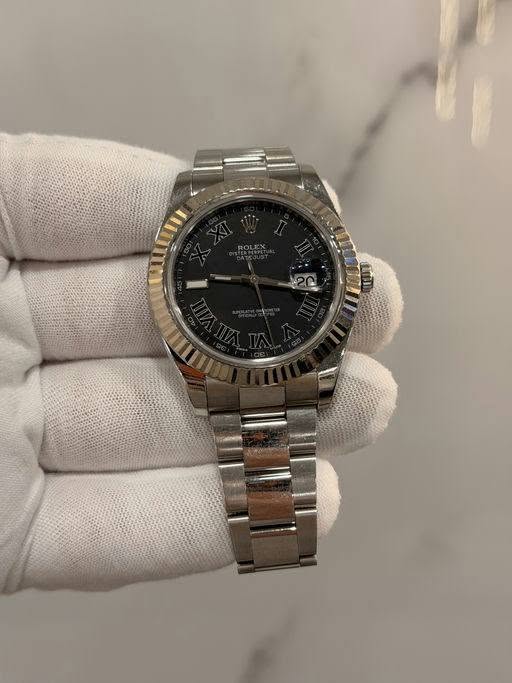 May be an image of wrist watch