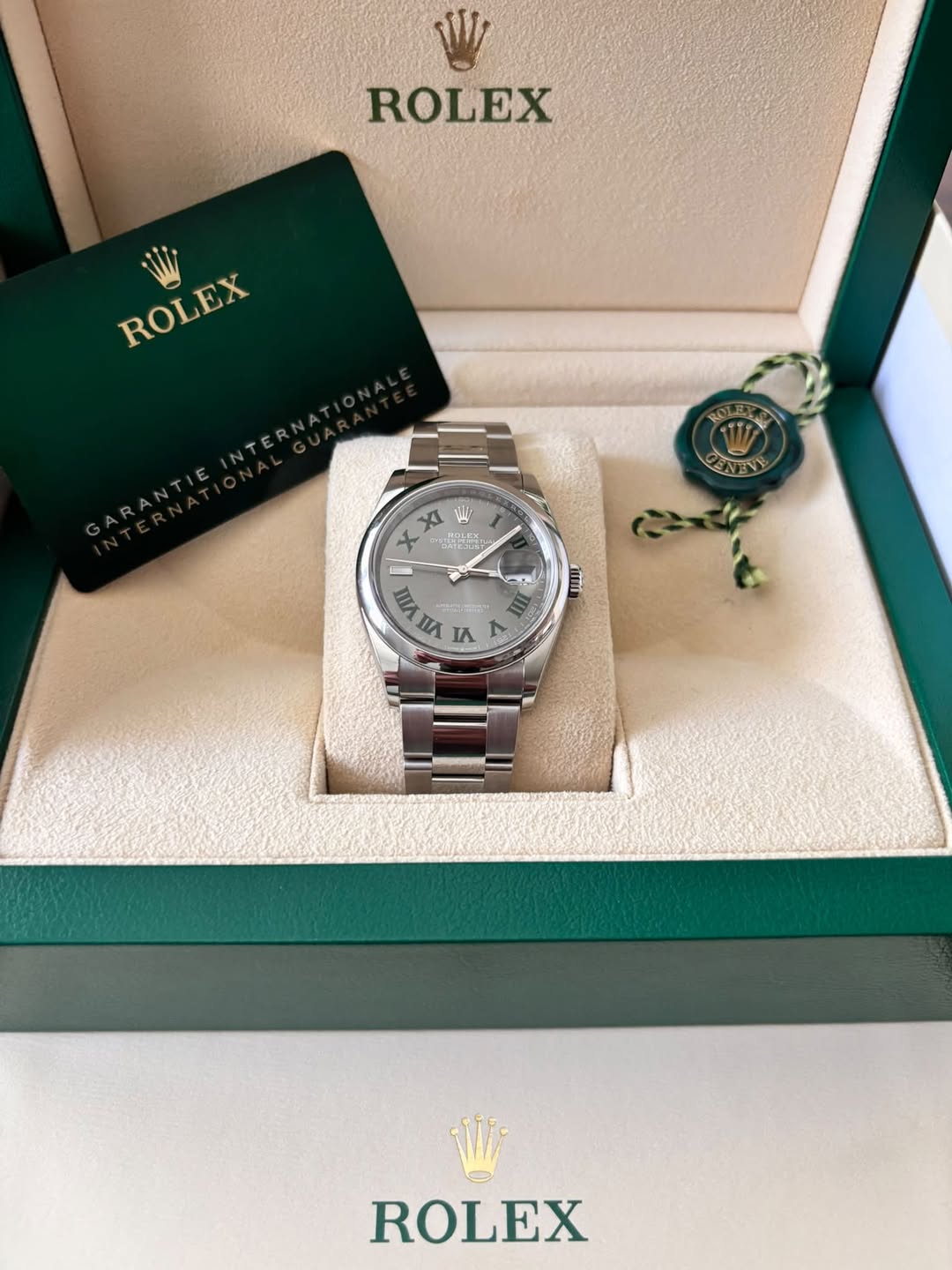 May be an image of wrist watch and text