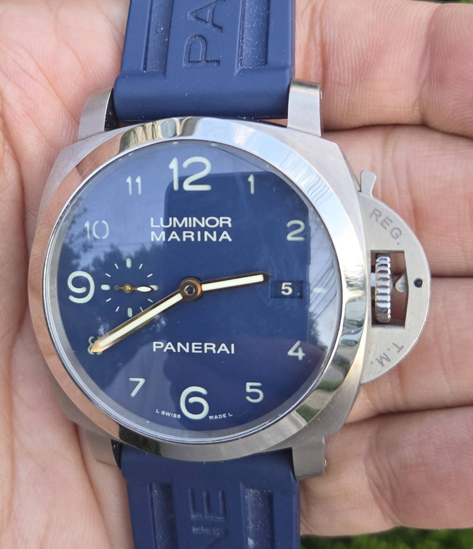 May be an image of wrist watch and text that says ' LUMINOR MARINA 2 9 5 REG REG ITI0 W y PANERAI 4 7 5 SWISS 6 7.5 MAD MADE'