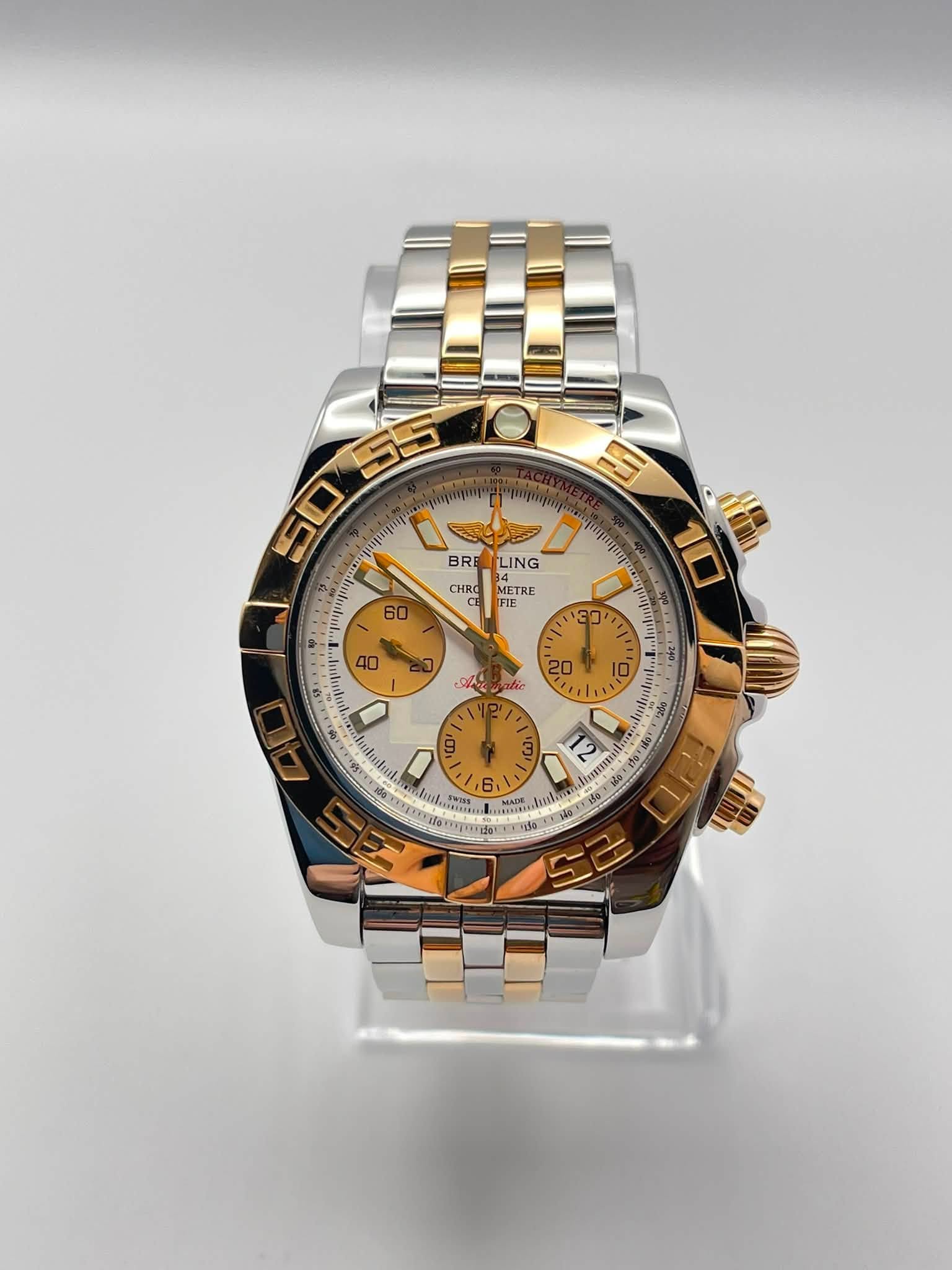 May be an image of wrist watch and text