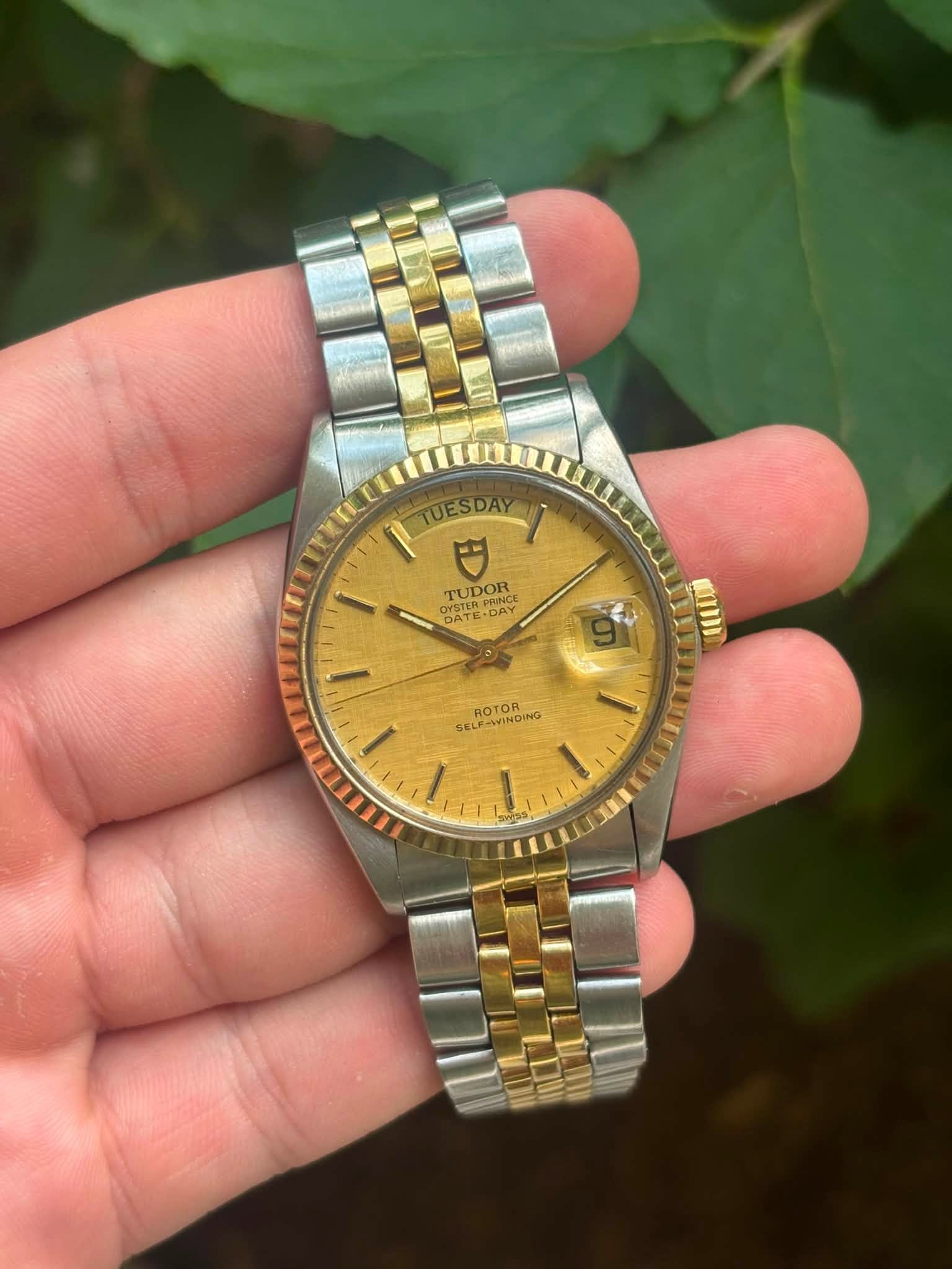 May be an image of wrist watch and text