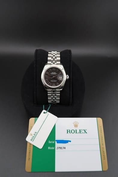 May be an image of wrist watch and text that says '20 ROLEX ROLE EX INTEANATION INTEANATION Serial Model Model279174 279174'