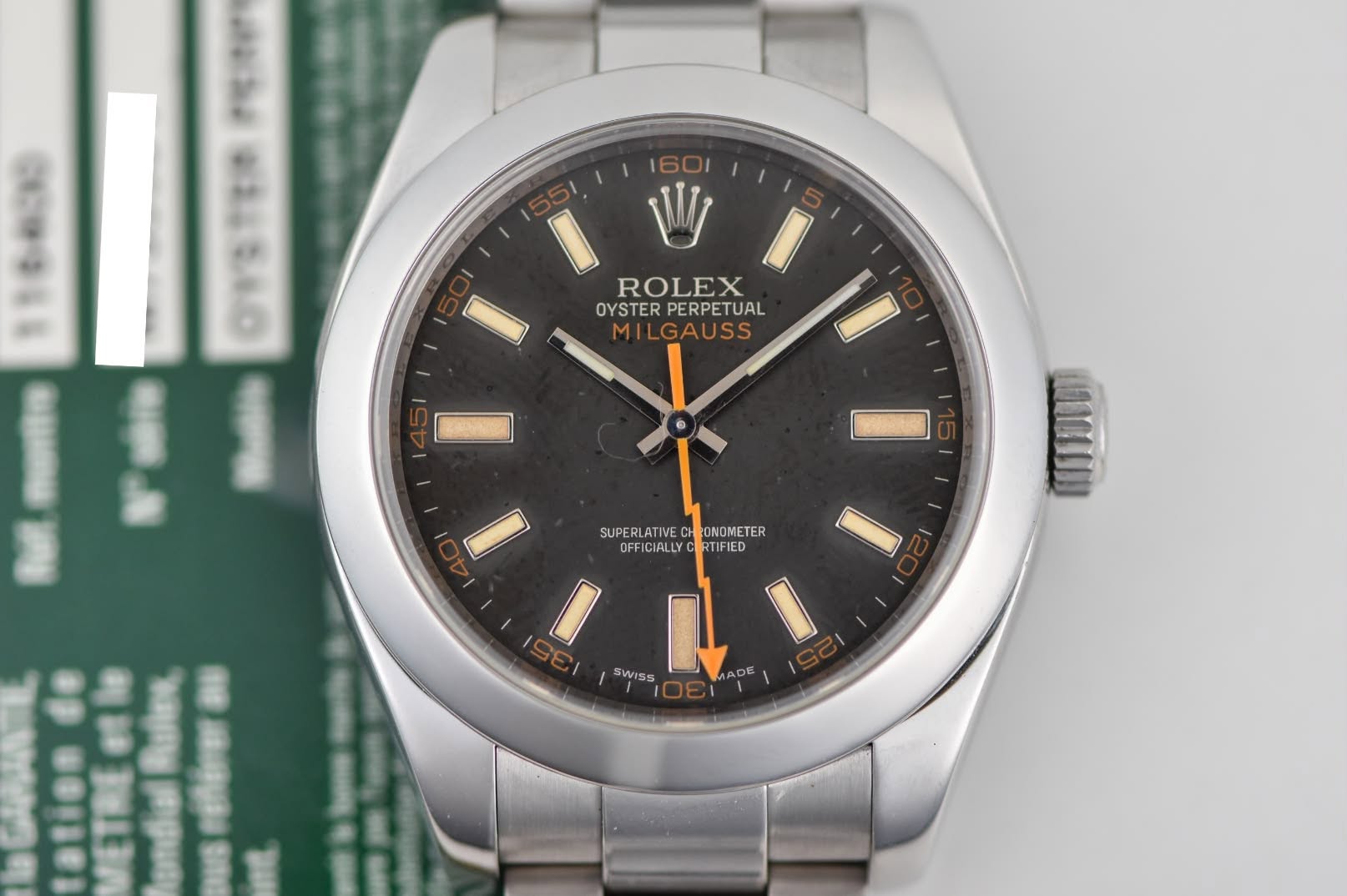May be an image of wrist watch and text that says 'MELEAO I W ROLEX I OYSTER PERPETUAL MILGAUSS 10 I SUPERLATIVEC ONDMETER OFFICIALLY SUPERLATIVECHCONOMETER BT RTIFIED ISEI I SWISS…