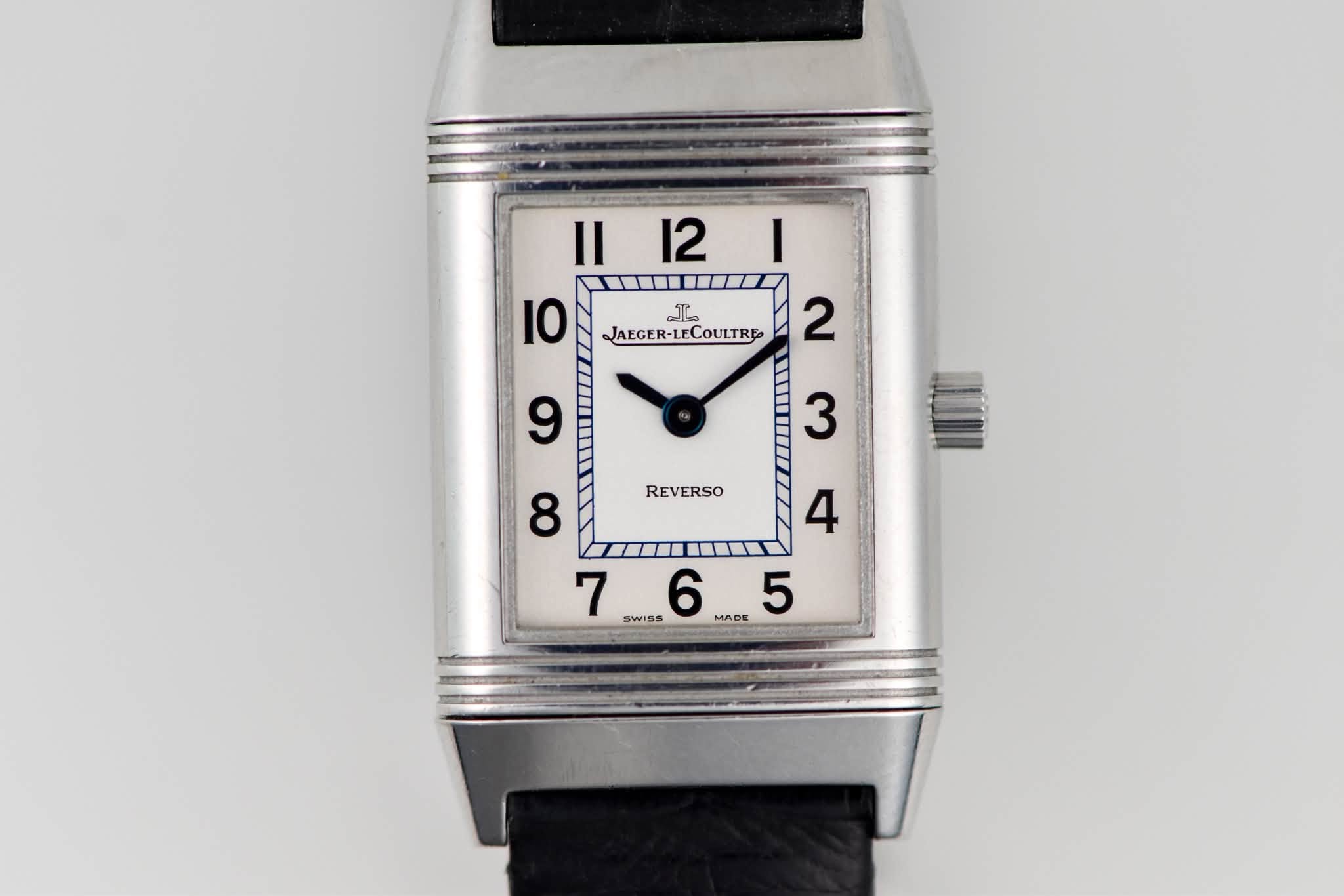 May be an image of wrist watch and text that says '||12| I Il 12 I0 2 ΰ΄ͺΰ΄ JAEGER-LECOULTRE 9 3 REVERSO 8 4 7 SWISS S 6 7.6..5 MADE 5'