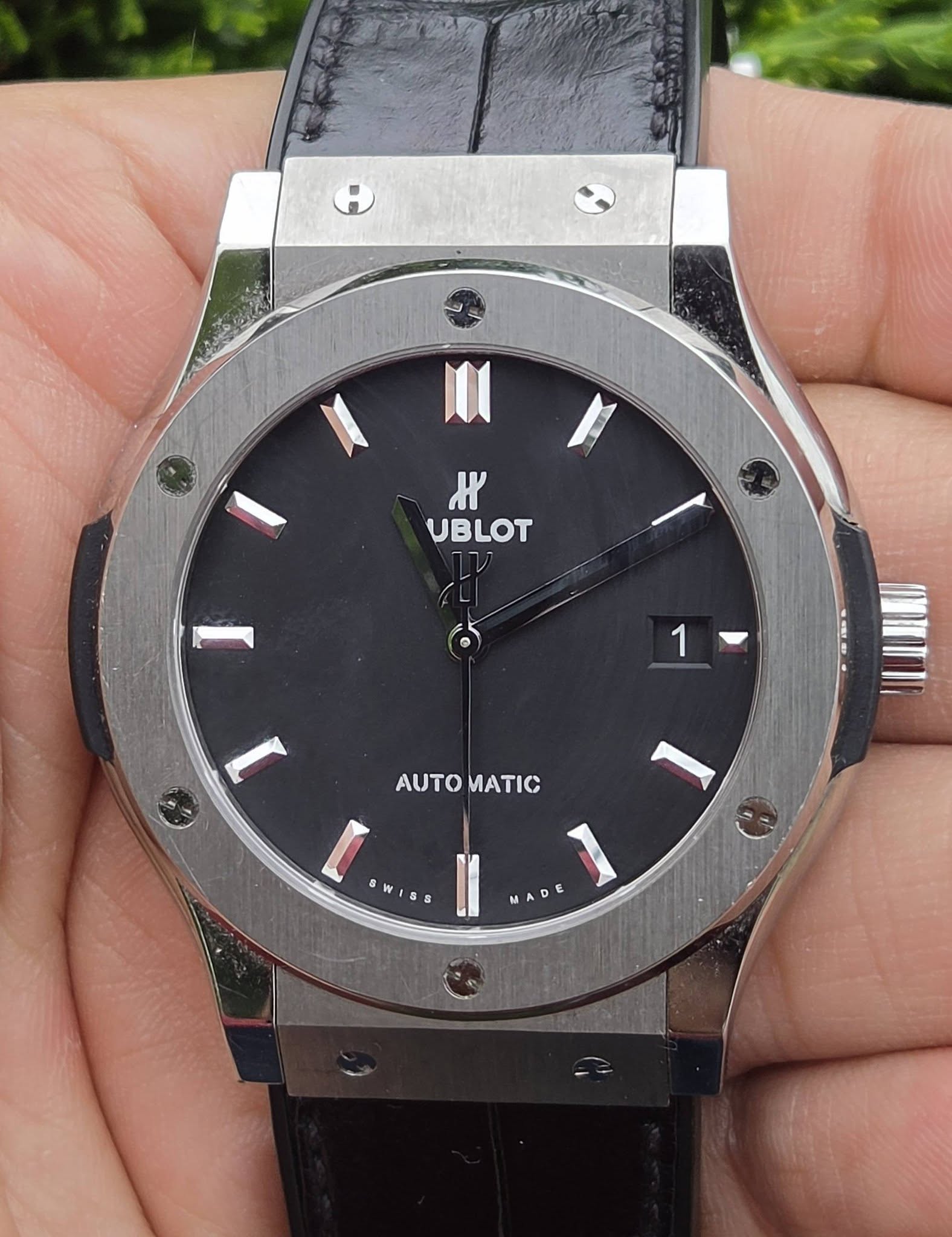 May be an image of wrist watch and text