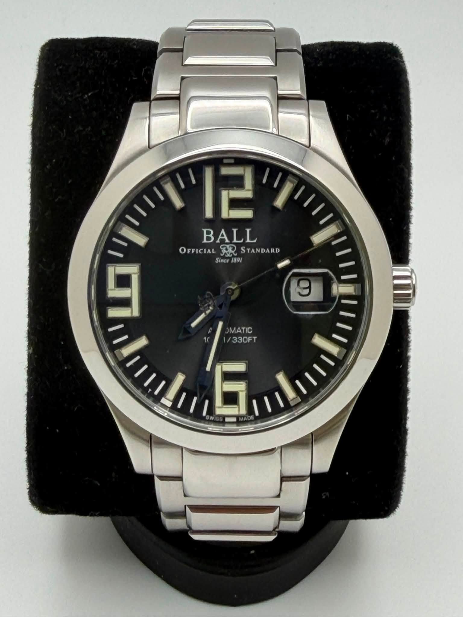 May be an image of wrist watch and text that says 'BALL OFFICIAL OFFCIALRSTANDARD कर STANDARD Sincr1891 9 9 OMATIC 330FT'