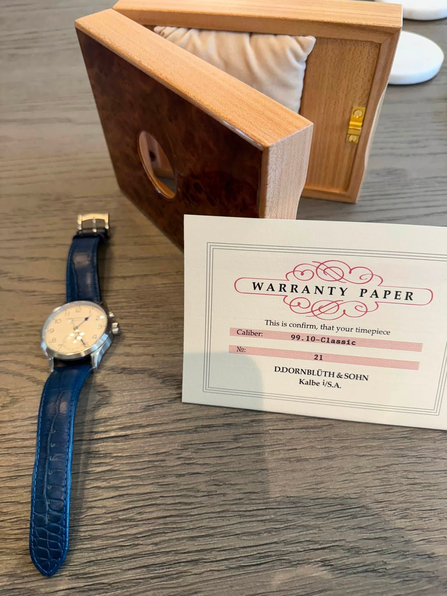 May be an image of wrist watch and text that says 'ลแจ എ്തා WARRANTY PAPER This confirm, that Thisls.confirm,thatyourtimeplem your timepiece Caliber: 99.10-Classic N: No: 21…