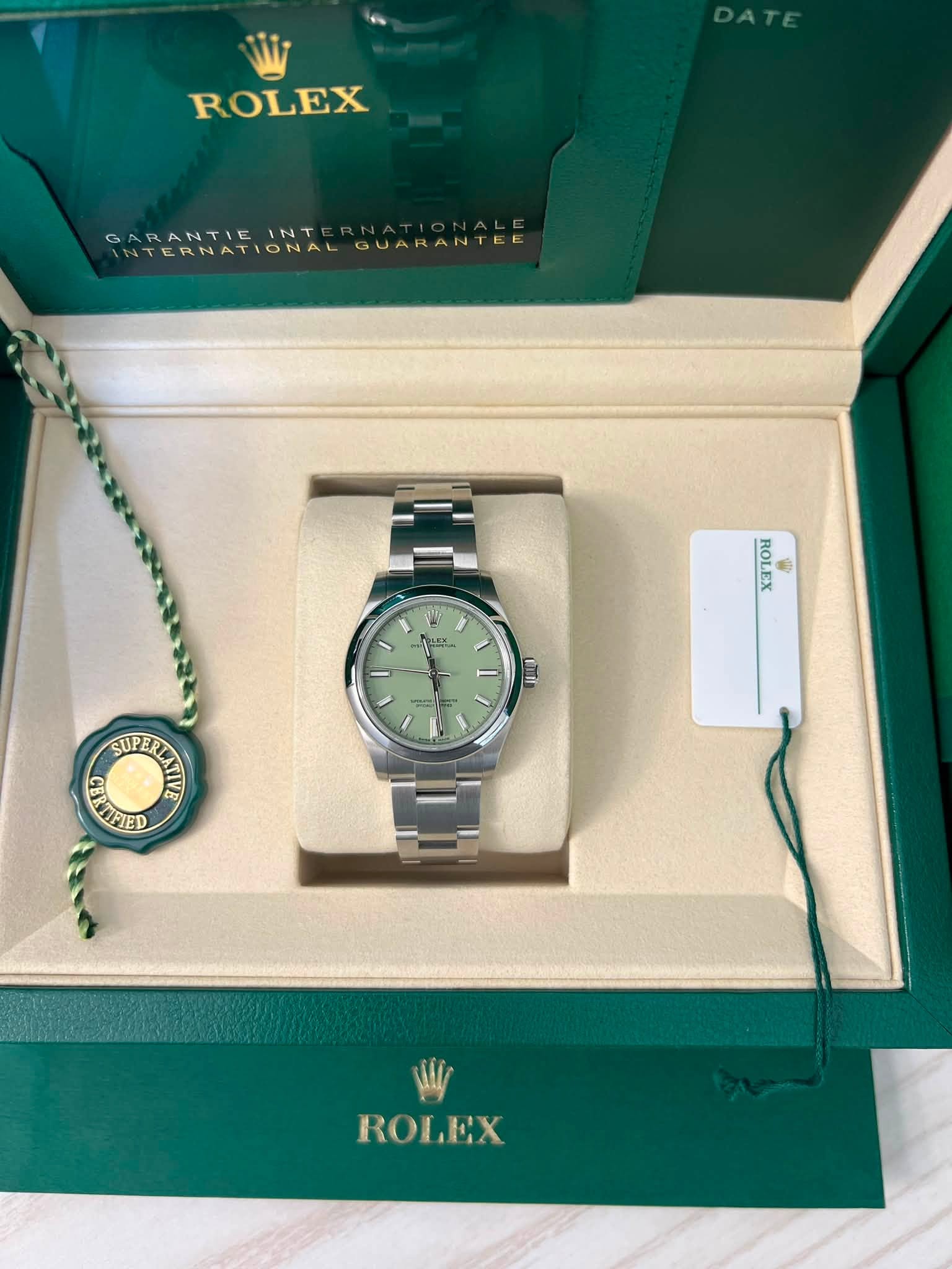 May be an image of wrist watch and text