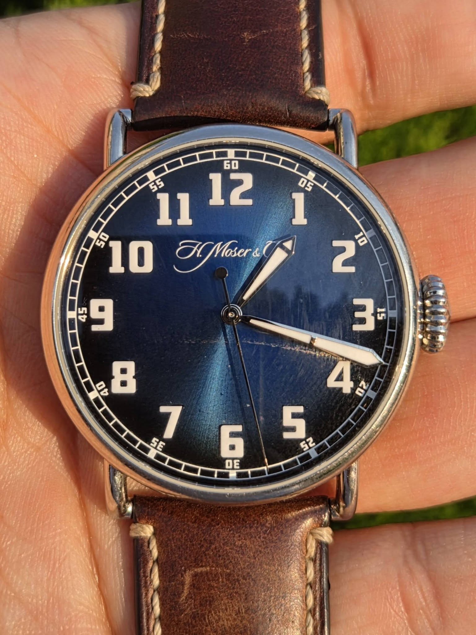 May be an image of wrist watch and text that says ' илR MMasers 2 10 45 Ln و SE DE'