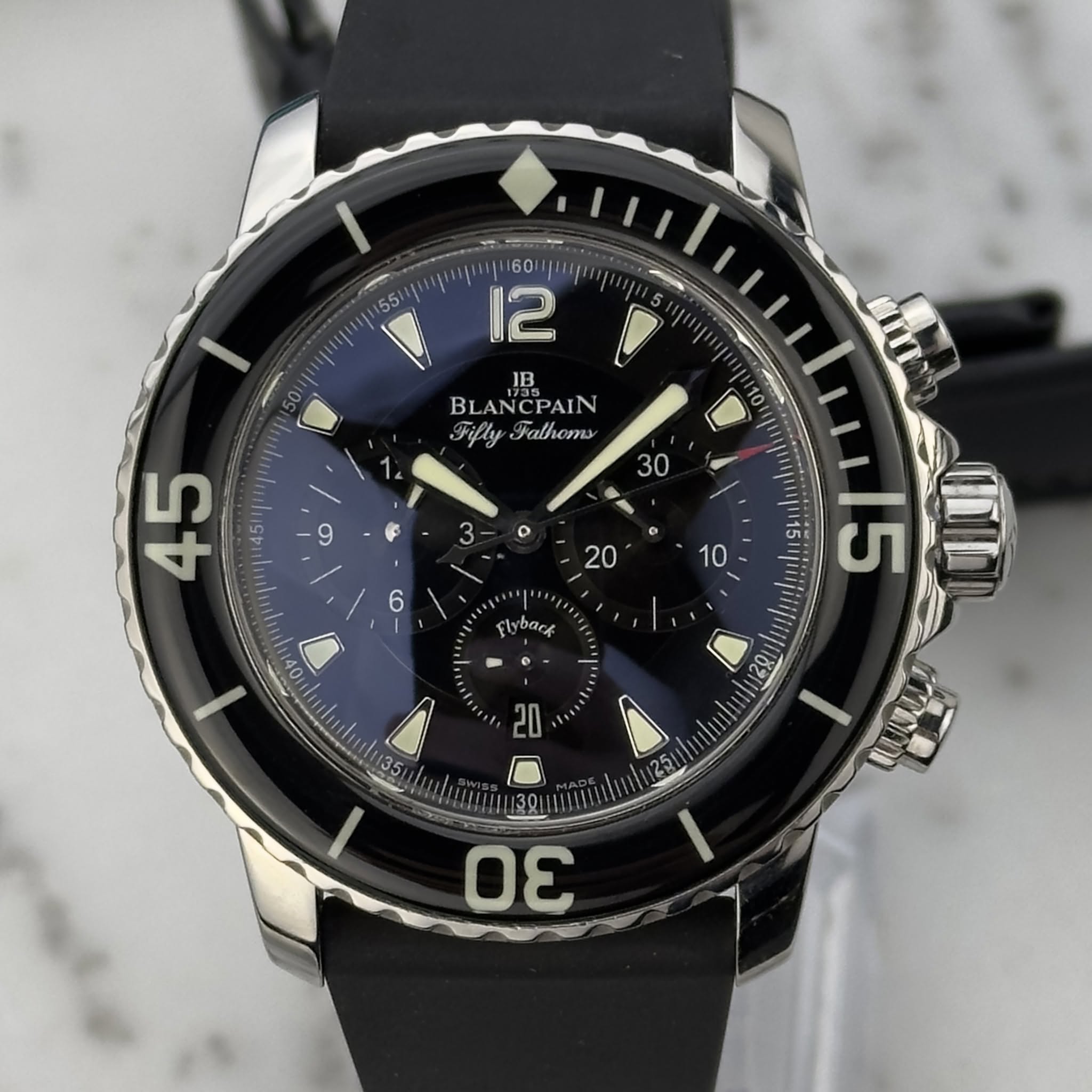 May be an image of wrist watch and text that says ' ま 12 JB BL BLANCPAIN Fifly Falhoms 30 9 F 3 o 45 o 20 6 10 lyback 10V | e 15 15 O Il II ی '