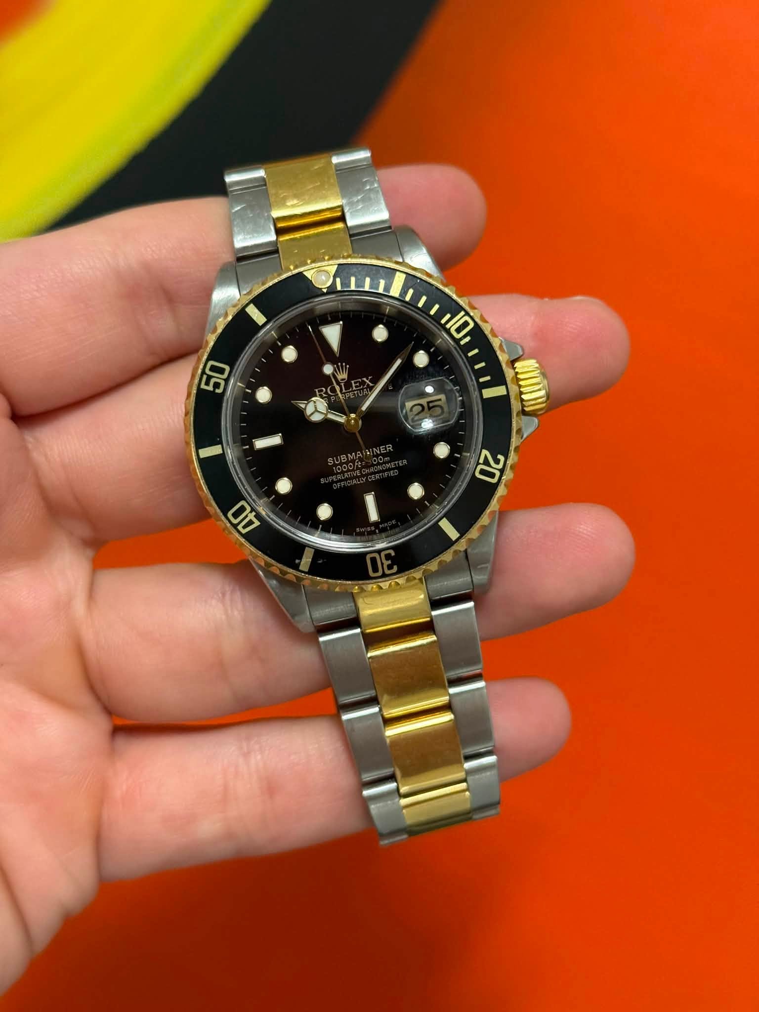 May be an image of wrist watch and text