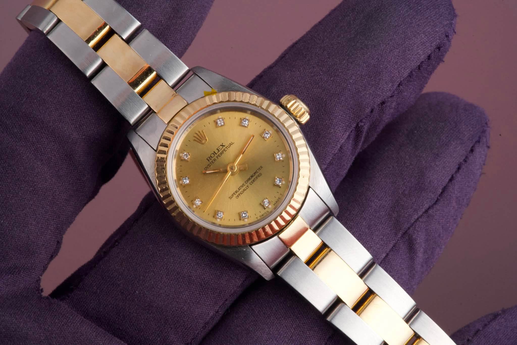 May be an image of wrist watch and text