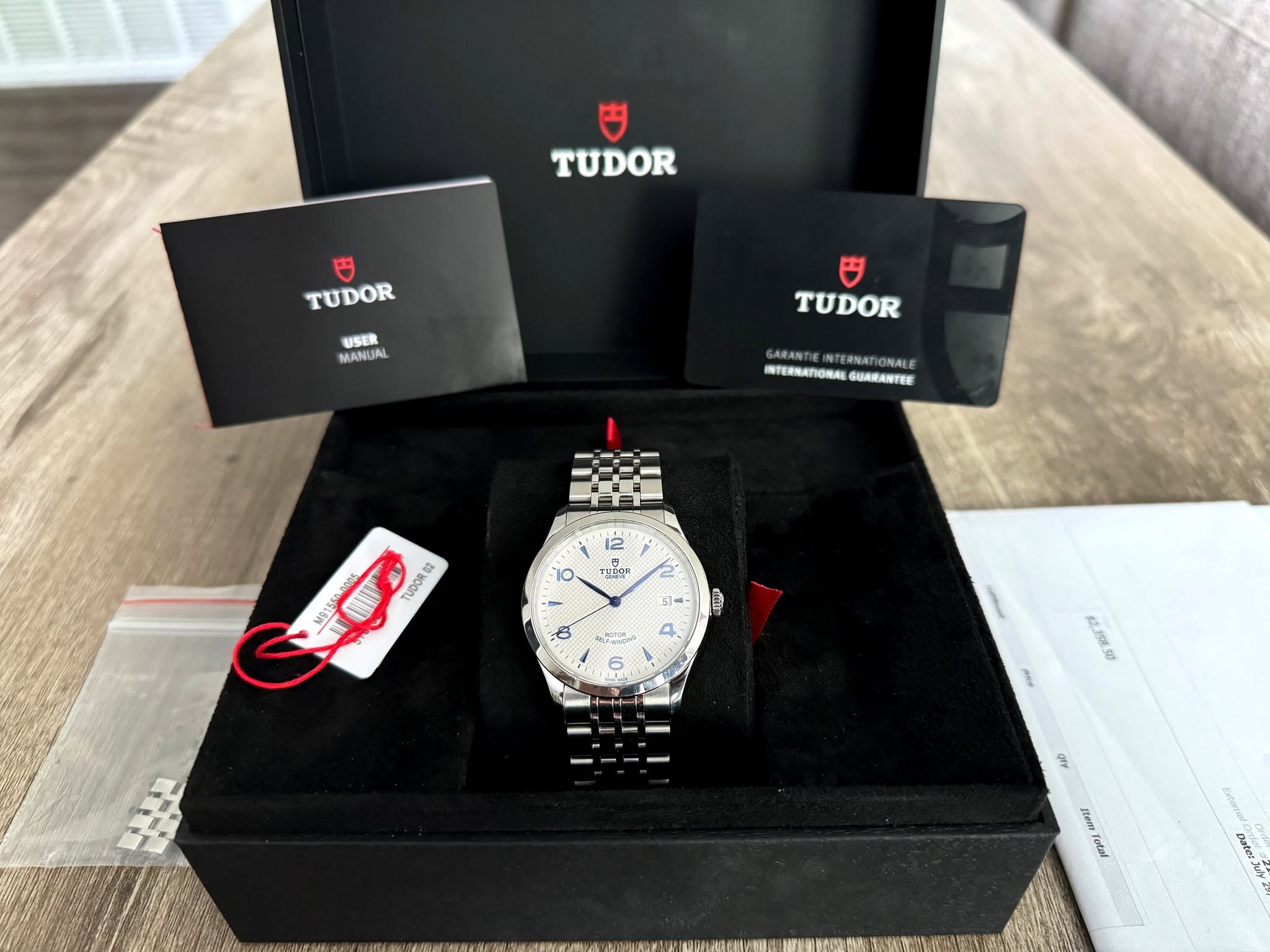 May be an image of wrist watch and text