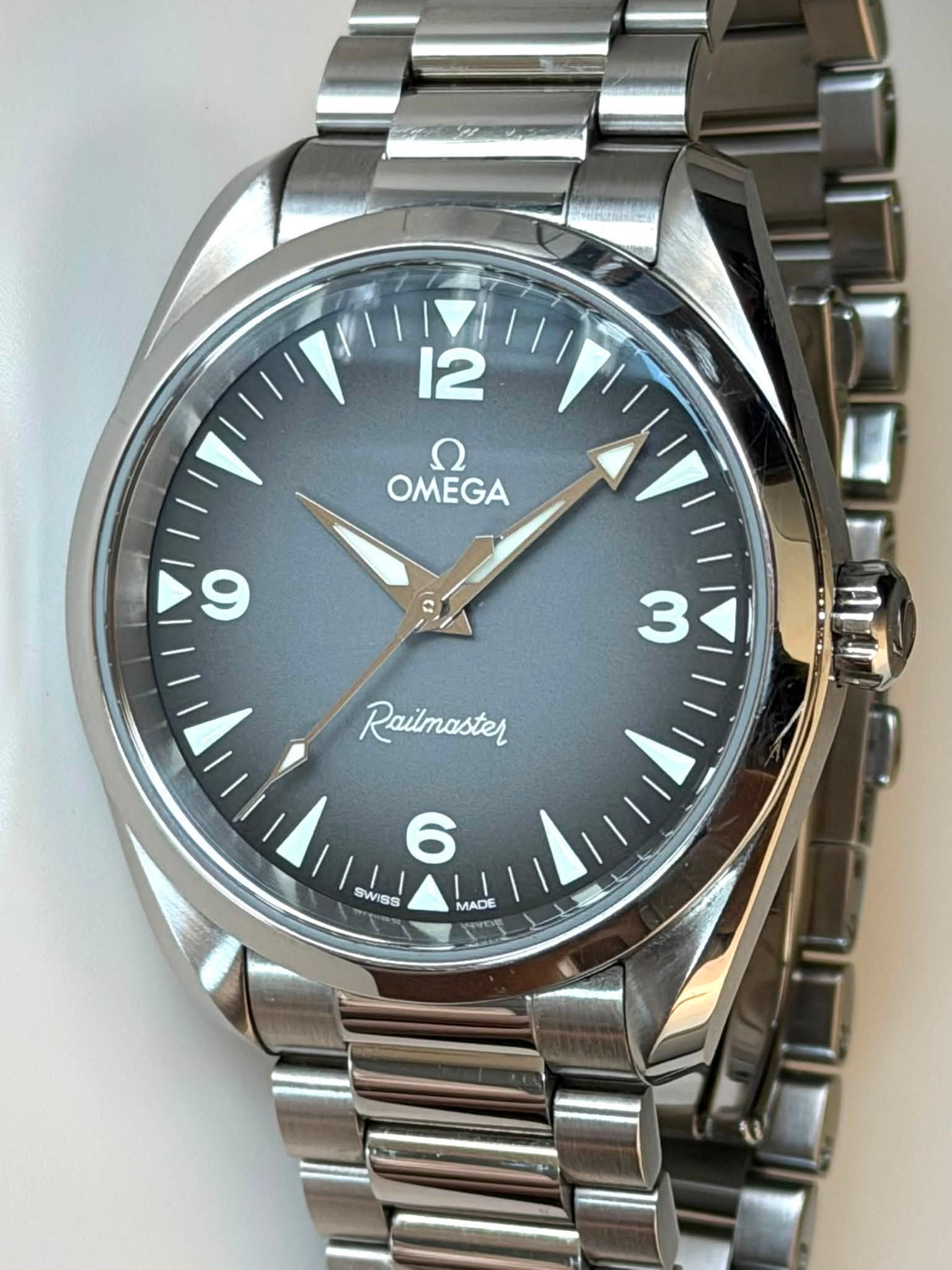 May be an image of wrist watch and text that says 'иoHe 12 ח OMEGA 3 A Railmnaster 6 SWISS MADE'